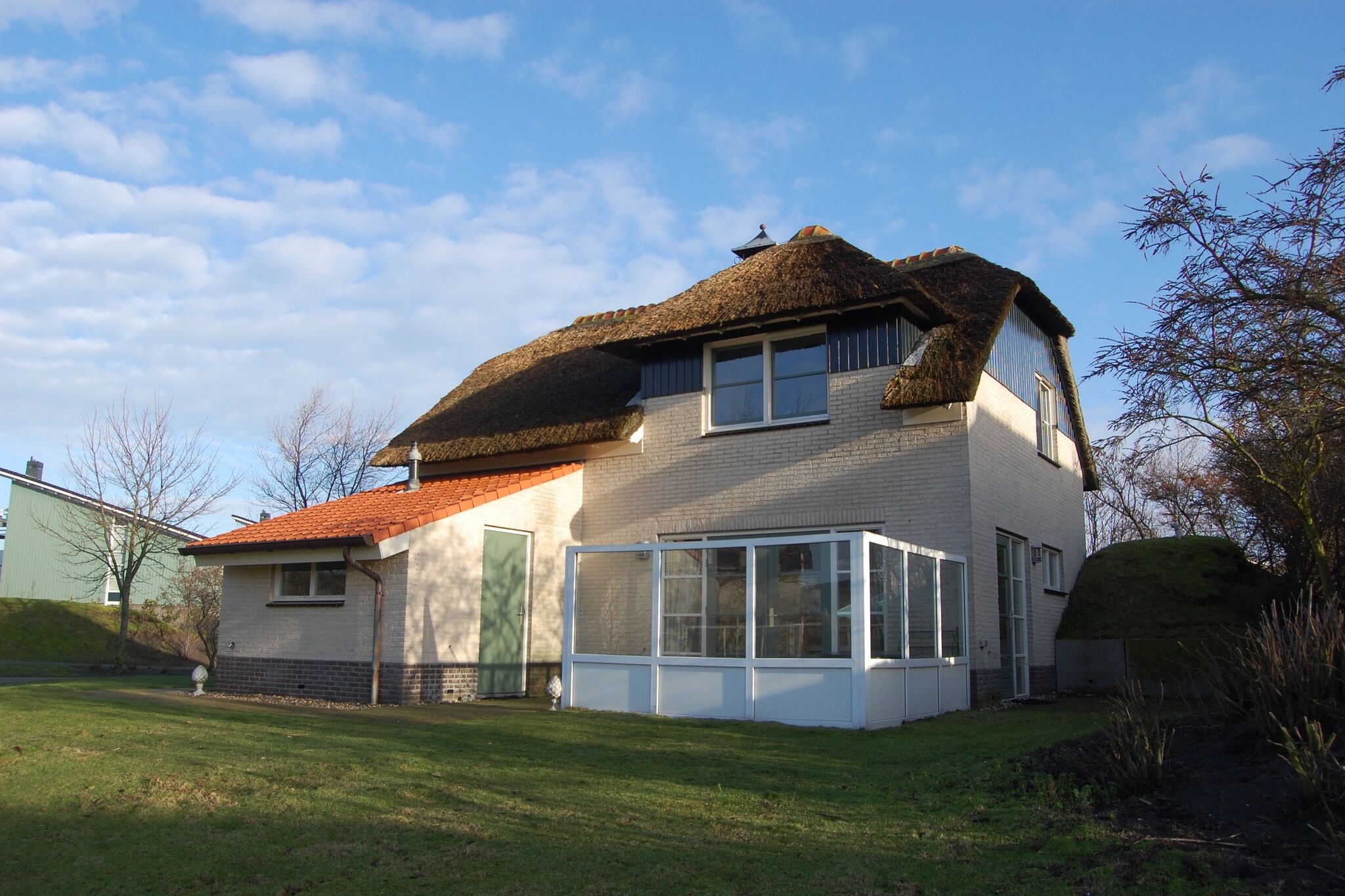 Thatched villa with bath in a holiday park