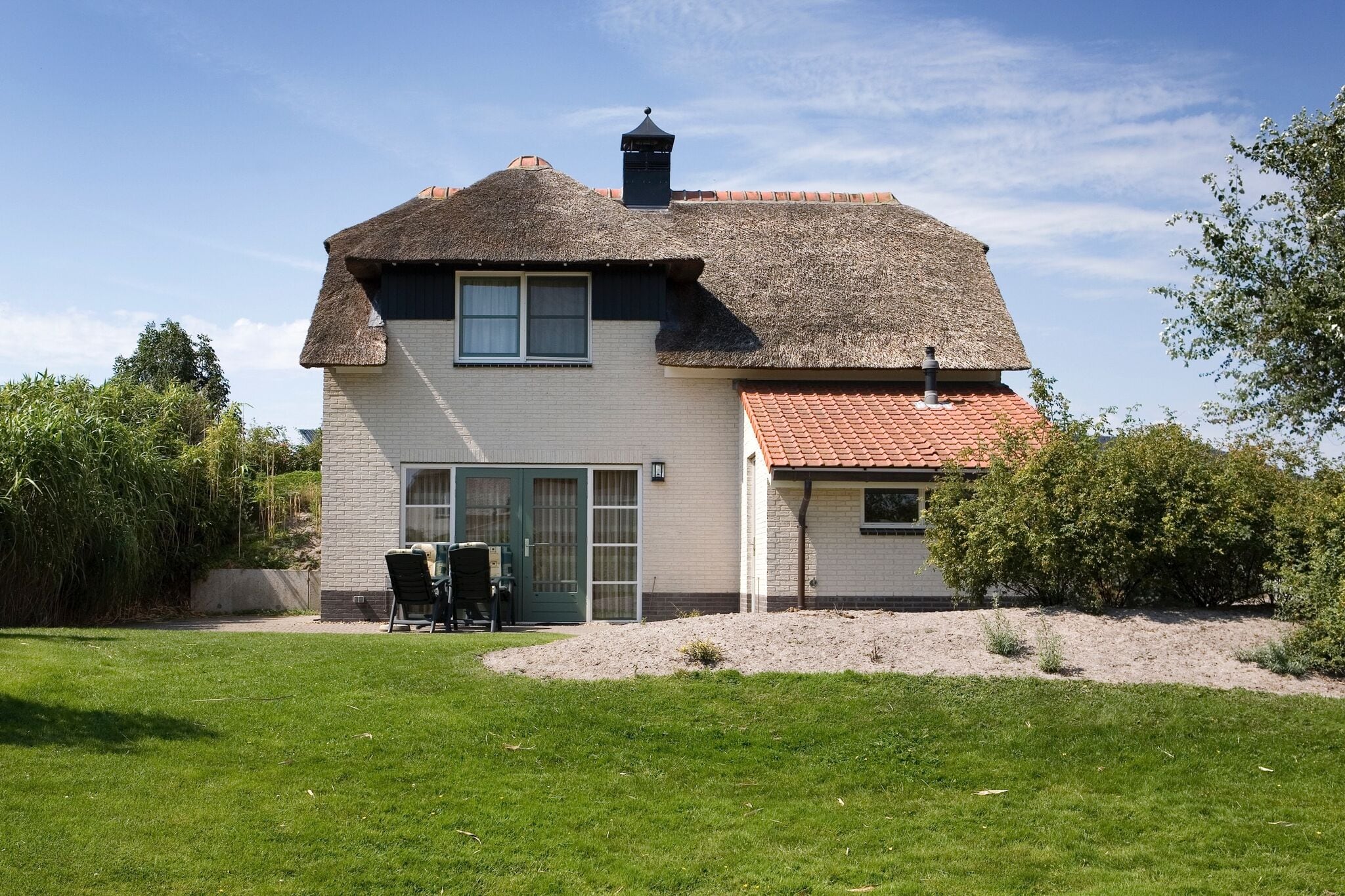 Thatched villa with bath in a holiday park