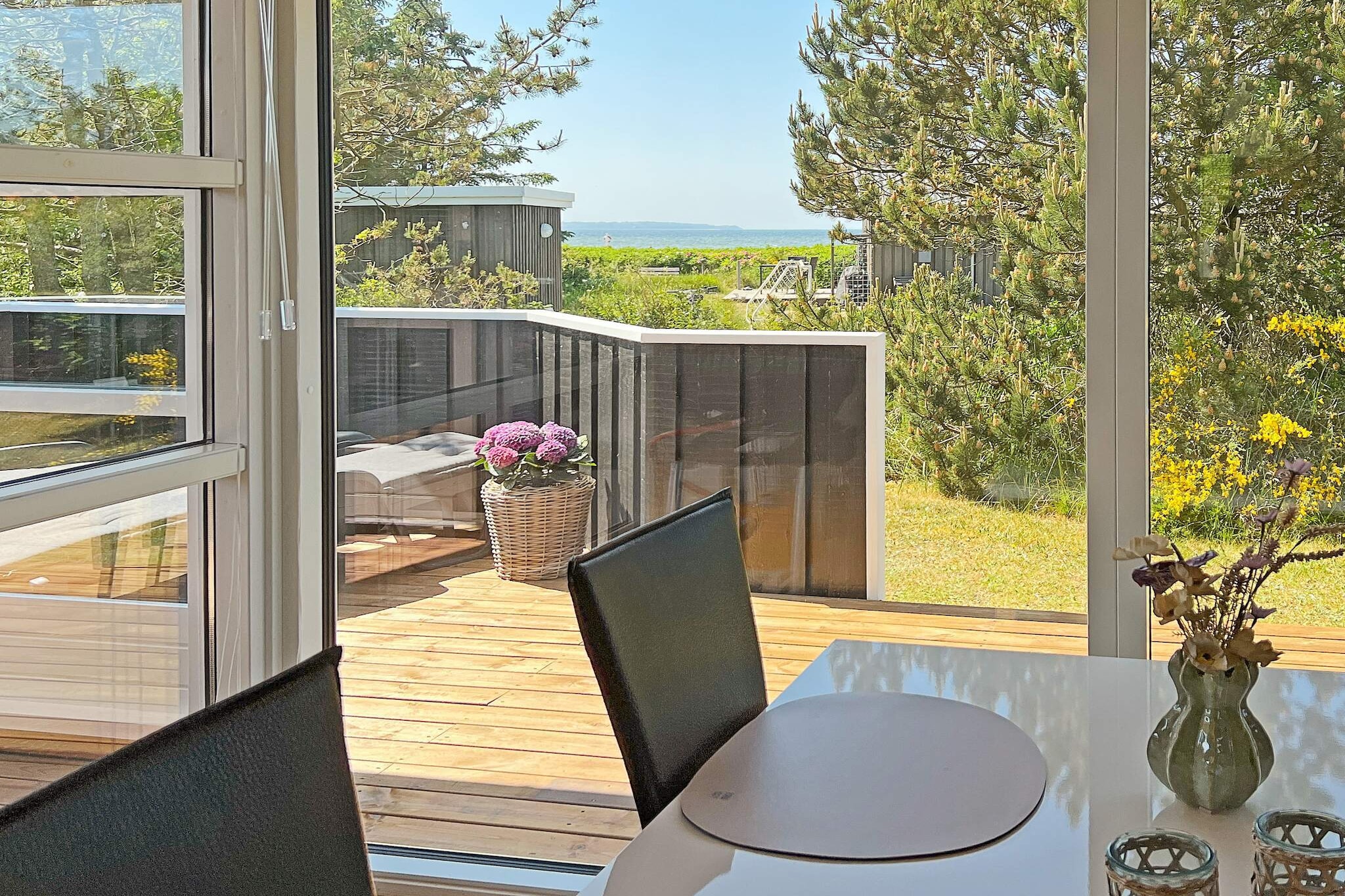 Well-located and well-maintained vacation home with water views, hot tub, and sauna located just 150 meters from the Limfjord at Trend. The holiday home is energy efficient with a heat pump that allows for lower consumption. The holiday home is bright and inviting and practically furnished with a combined living room/kitchen. The living room has modern furniture, free internet, and a flat-screen TV with satellite dishes with German channels, international channels, and Danish TV, including TV2. There is a wood-burning stove for cool summer evenings or rainy autumn evenings. Kitchen with ceramic hob, extractor hood, microwave, coffee maker, fridge/freezer, and dishwasher. Bathroom with shower, bathtub, toilet, whirlpool, and sauna for four people. The house has three bedrooms with comfortable beds, two with double beds and one with two single beds. There is also a loft with fold-out mattresses (for children). There is a washing machine and dryer in the utility room. There is both an open and covered terrace with comfortable garden furniture, sun loungers, and a gas grill where you can enjoy dinner while watching the sun set over the Limfjord. There is a playhouse in the garden. Not available for youth or work groups. A large communal playground is located 0.5 km from the house, and Landal Rønbjerg (water park and playground) is 7 km from the house. Løgstør or Farsø are 13 km from the holiday home. Smoke alarms are also available.A refundable deposit might be charged closer to your check-in date. The security deposit ensures a smooth stay and covers any additional services or consumption charges.This deposit covers utilities consumed during your stay and any additional services that may be taken.The final amount will be adjusted based on actual meter readings, actual usage of extra services, and any remaining balance will be refunded within 21 days after checkout.This deposit simply acts as a prepayment for charges that you would anyways pay for, ensuring a seamless stay and check-out experience.