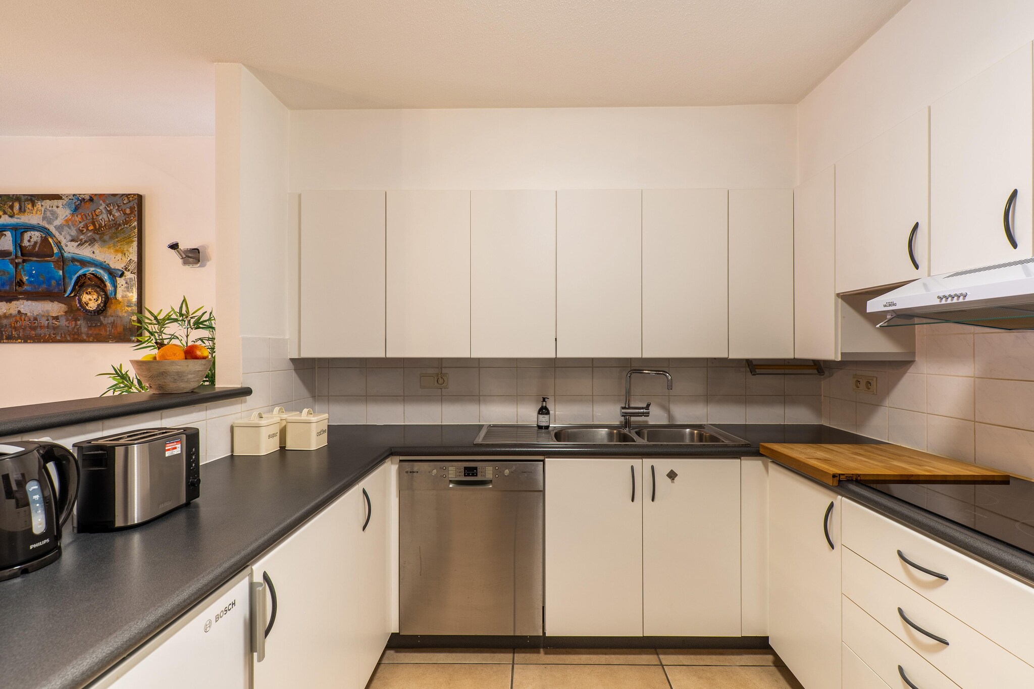 On the 2nd floor: (Entrance, open kitchen(electric kettle, espresso machine, combination microwave, dishwasher, fridge, freezer), Living/diningroom(TV, dining table, seating area), bedroom(double bed, TV), bedroom(double trundle bed), bathroom(shower, washbasin), toilet(toilet))\n\ngarage(shared entrance), washing machine, balcony, balcony, garden furniture