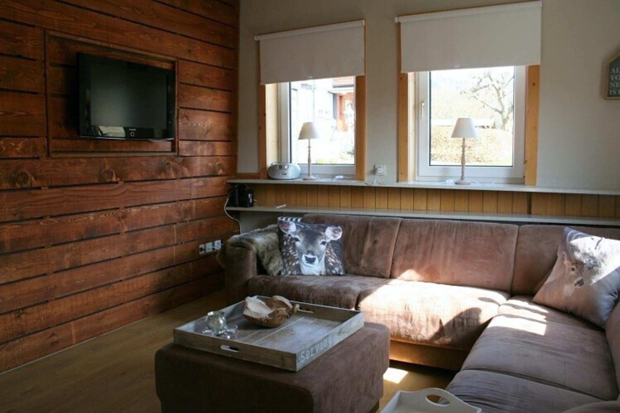 Ground floor: (Entrance, hall, TV room(TV, seating area), Kitchen(electric kettle, toaster, cooker(ceramic), cooker(ceramic), coffee machine, oven, dishwasher, fridge, freezer), Living/diningroom(TV, dining table(14 persons), fireplace, seating area), bedroom(double bed(boxspring)), bedroom(single bed(boxspring), single bed(boxspring)), bathroom(shower, washbasin, toilet))\n\nOn the 1st floor: (bedroom(double bed(boxspring), double bed(boxspring), children\'s bed), bedroom(single bed(boxspring), single bed(boxspring)), bedroom(single bed(boxspring), single bed(boxspring), double bed(boxspring), children\'s bed), bathroom(bath tub, shower, washbasin, toilet), bathroom(shower, washbasin, toilet))\n\nstorage, tumble dryer, cot, washing machine, terrace, garden, garden furniture, BBQ, 5x parking, high chair