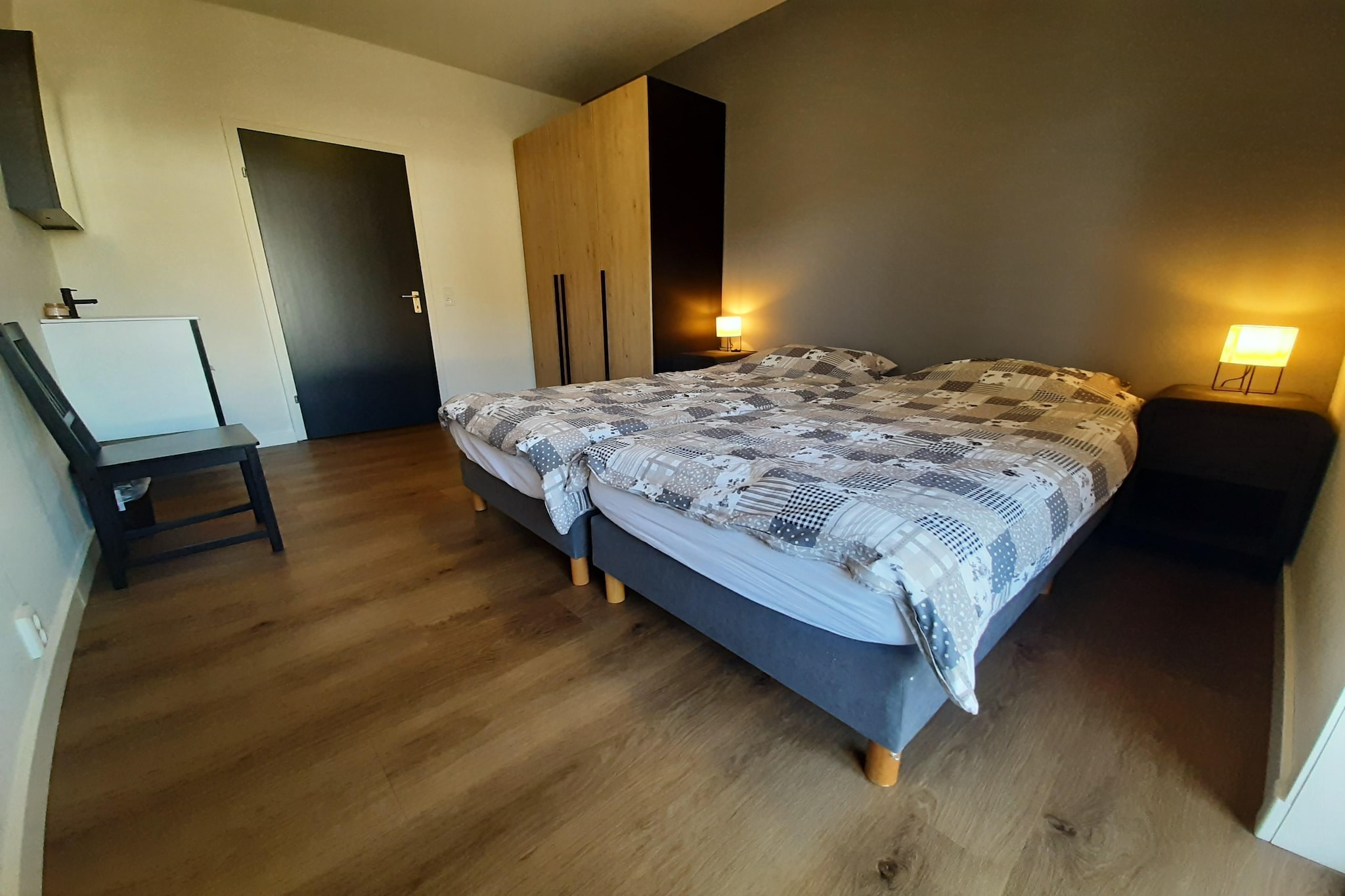 On the 1st floor: (Living room(TV, seating area), Kitchen(dining table(10 persons), seating area, hob, electric kettle, hood, oven, oven, microwave, dishwasher, fridge-freezer, balcony), bedroom(double bed, washbasin), bedroom(double bed, washbasin), bedroom(bunk bed, washbasin), bedroom(bunk bed, bunk bed), bathroom(shower, washbasin, toilet), toilet(washbasin, toilet))\n\nterrace, garden, garden furniture, BBQ, parking