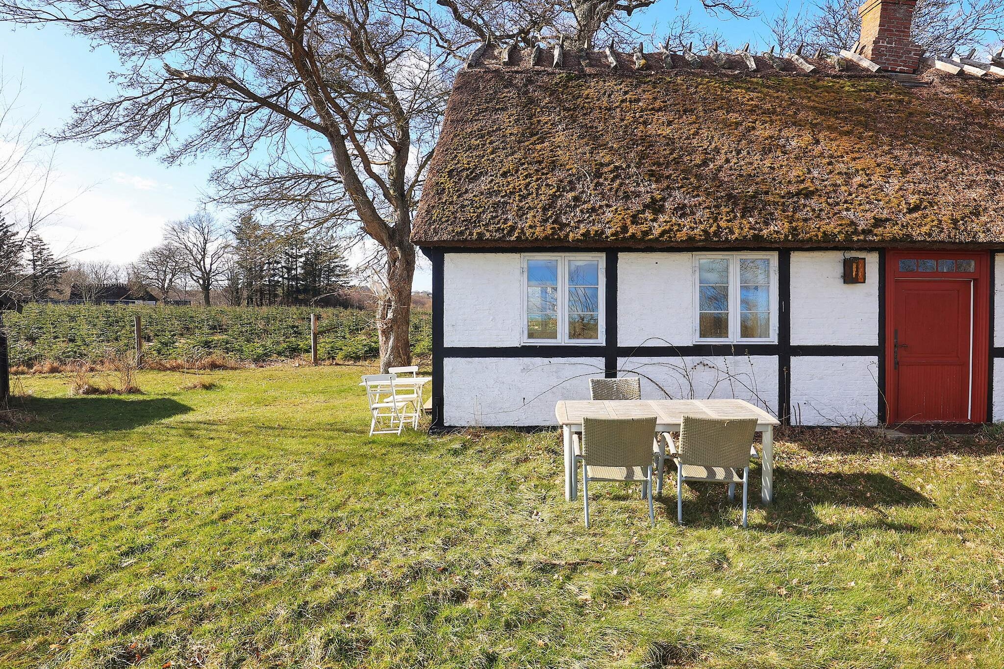 This charming holiday home near PrÃ¦stÃ¸ offers complete peace and relaxation in a beautiful natural setting. The thatched half-timbered house was originally built around 1800 and has been carefully modernized over the years. The renovations preserve the historic character and rustic charm of the house while providing modern comfort for a cozy stay. On the ground floor, you will find a practical utility room, a bathroom, a fully equipped kitchen, a dining area, and a welcoming living room perfect for family gatherings or quiet evenings. The first floor has two bedrooms with single beds that can be joined to form double beds. Both rooms feature nostalgic details, including lower ceiling heights typical of the period. Please note that the staircase to the attic is fairly steep. The property sits on a private natural plot surrounded by forest, providing tranquility and space to enjoy the outdoors. A terrace, hammock, and swings create ideal spots for relaxation. Except for one neighboring house, the property is secluded and only a few hundred meters from PrÃ¦stÃ¸ Fjord. The fjord offers shallow, child-friendly waters perfect for swimming and playing. This idyllic home is ideal for families or couples seeking a quiet retreat in nature with a historic touch. It provides a unique combination of heritage, comfort, and outdoor enjoyment. Explore the surroundings, enjoy the scenic views, or simply relax in the peaceful setting. Please note: rental to youth groups is not permitted.