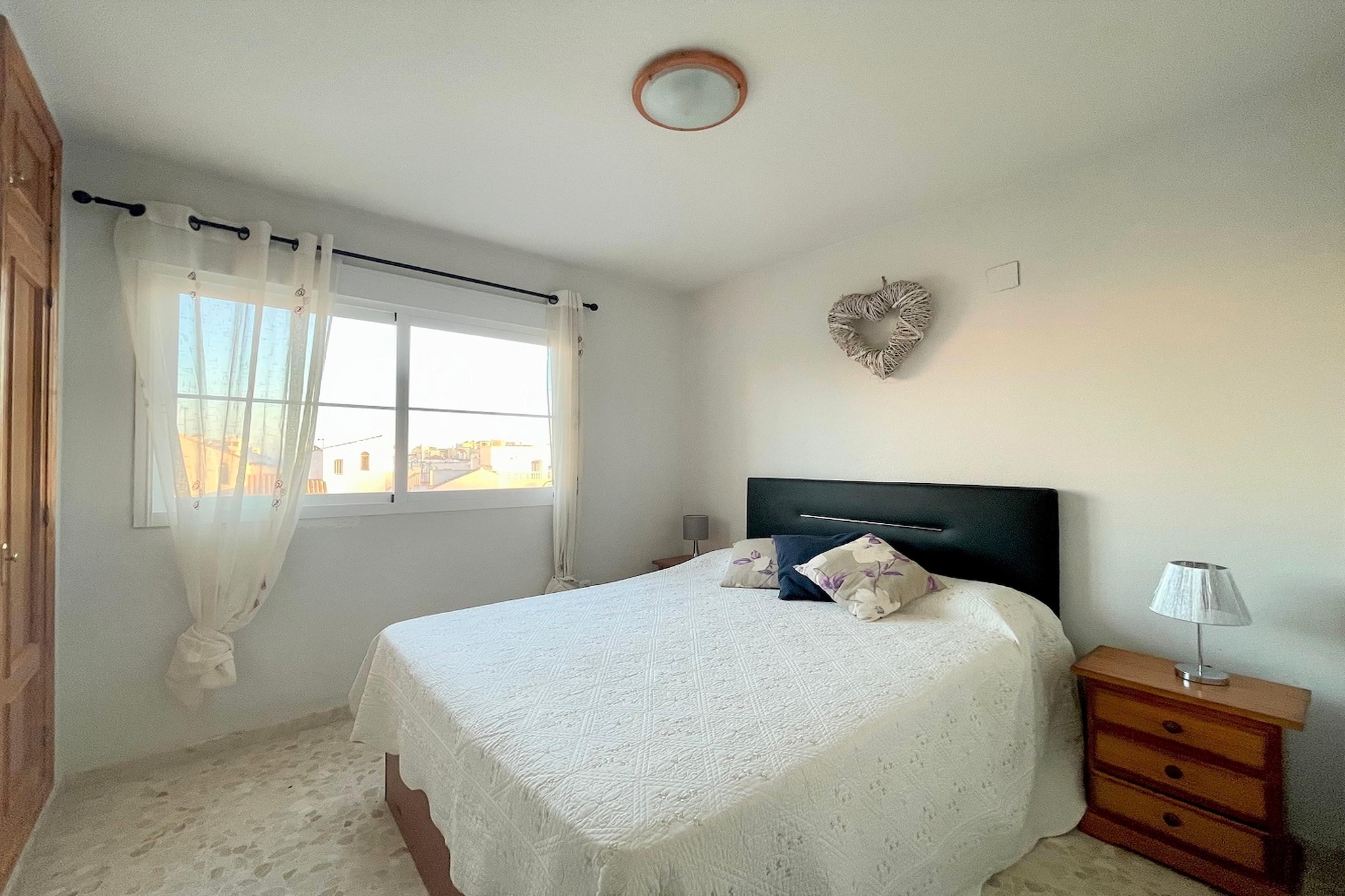 Ground floor: (Entrance(shared with other guests, reachable from the outside)(lift))\n\nOn the 2nd floor: (Entrance, Living room(single sofa bed, single sofa bed, TV(flatscreen), dining table, seating area), Kitchen(hob(4 ring stoves, electric), hood, coffee machine, microwave, fridge-freezer, washing machine), bedroom(double bed(135 x 190 cm)), bedroom(single bed(90 x 190 cm), single bed(90 x 190 cm)), bathroom(bathtub with shower, washbasin, toilet), dining table, garden doors, balcony or terrace, heating(electric))\n\nparking lot(public), swimming pool(shared with other guests, outside, opened from 1/2 Jun upto and including 1/2 Sep), ironing board, iron