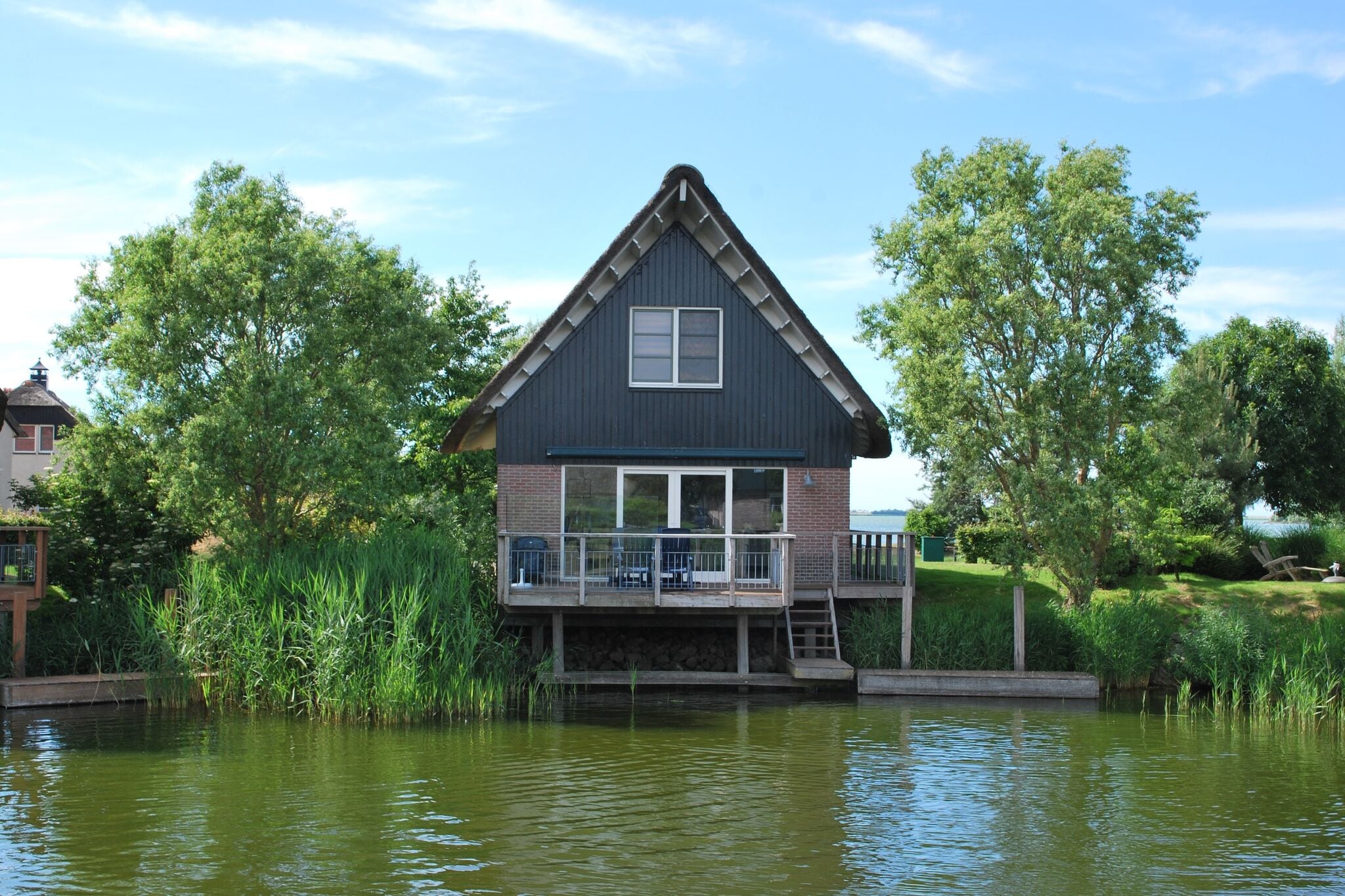 Villa on the water with sauna in Friesland