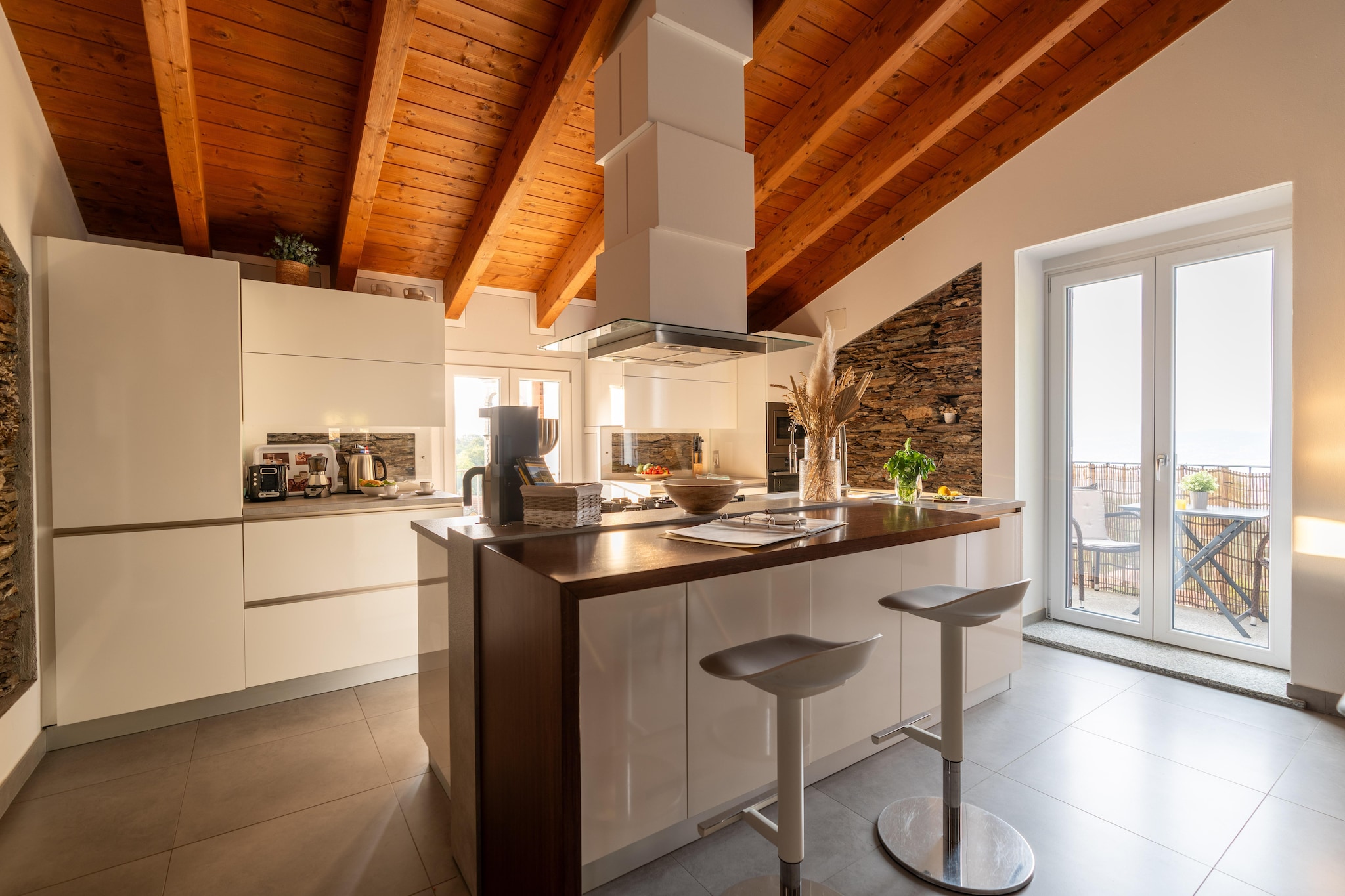 Ground floor: (Living room(TV, seating area), open kitchen(dining table, hob(4 ring stoves), electric kettle, toaster, hood, espresso machine, oven, dishwasher, fridge, washbasin), bedroom(single sofa bed, double bed), Bedroom with bathroom(double bed or 2 single beds, washbasin, toilet, bidet), bathroom(Bubble bath, shower, washbasin, toilet, bidet), washing room(washing machine))\n\nbalcony