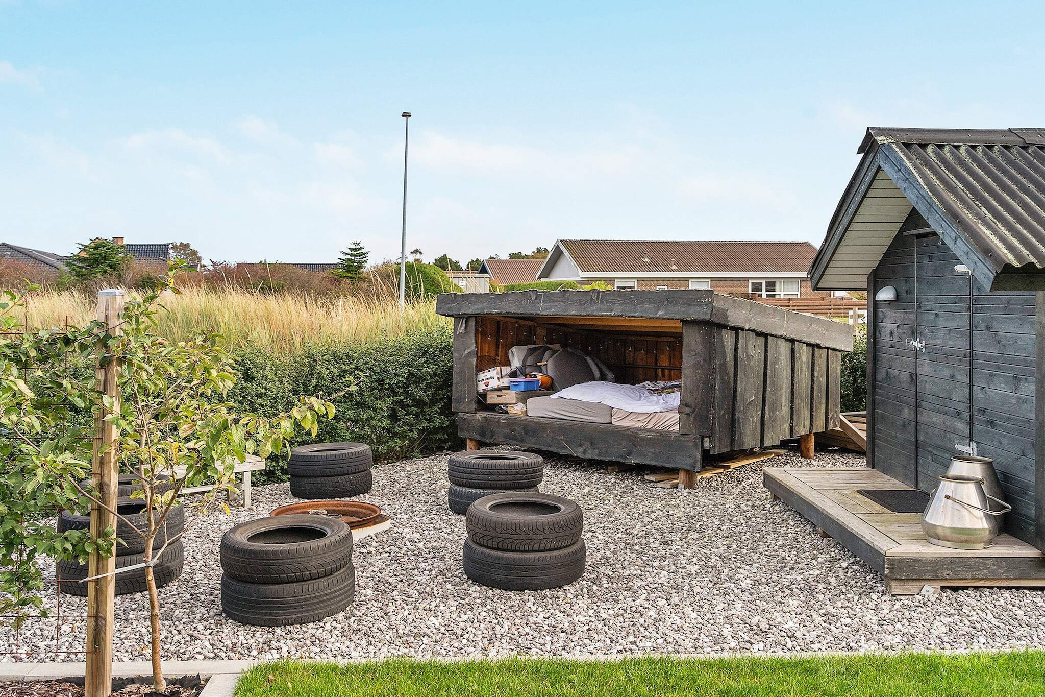 Annex: (double bed)\n\nKitchen(stove(induction), coffee machine, oven, microwave, dishwasher, fridge, freezer(140-199L), high chair), Living/bed room(TV(danish TV channels (DR1 and TV2))), bedroom(double bed), bedroom(double bed), bathroom(tumble dryer, washbasin, shower, toilet, washing machine), carport, heating(electric), terrace, garden, garden furniture, play equipment, air to water heatpump