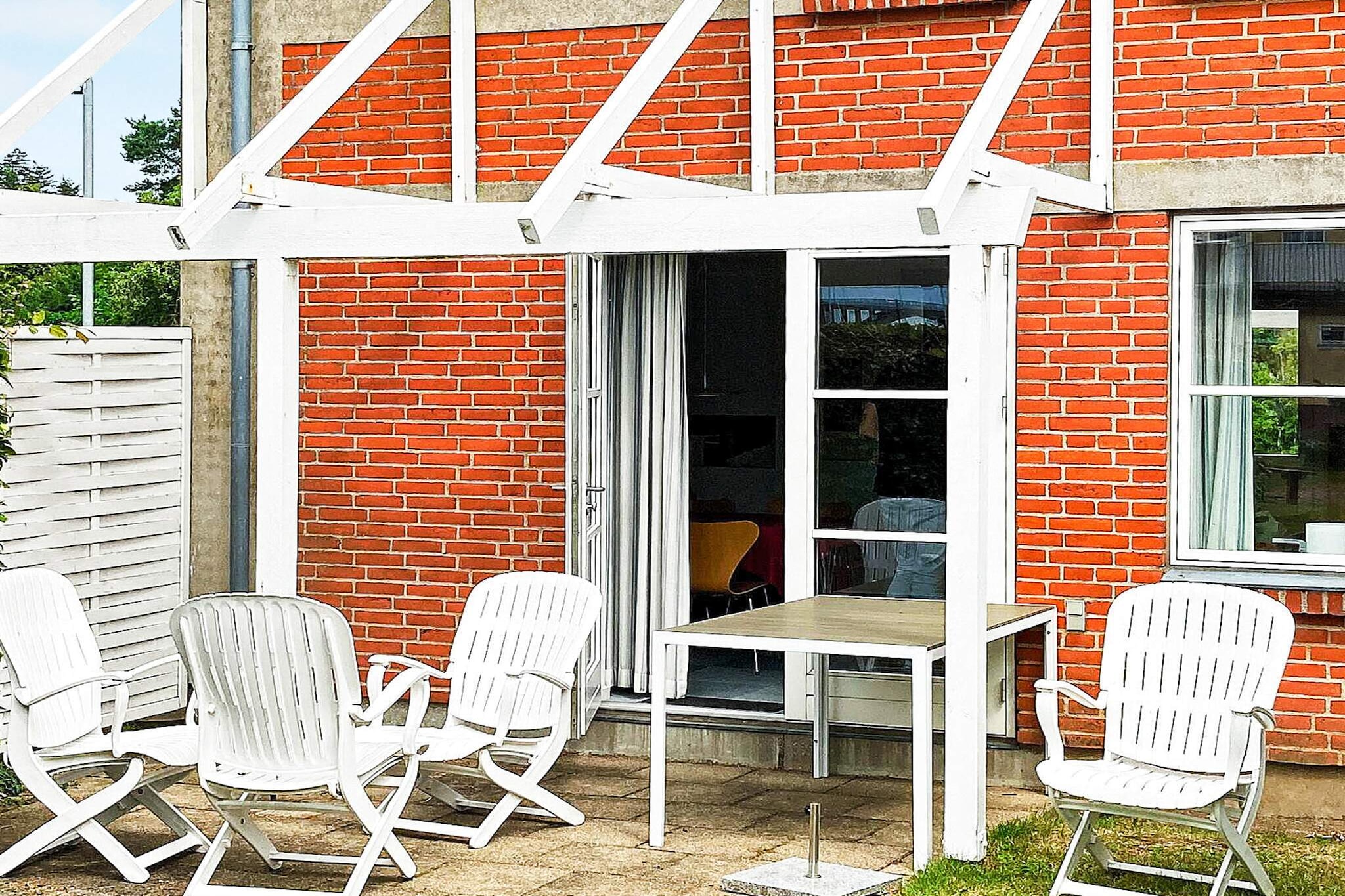 This semi-detached holiday home in Kalvehave is perfectly situated at the foot of the bridge to Møn, close to the marina, water, and a beautiful child-friendly beach. Spread over two floors, the property includes a lovely attached terrace and offers an ideal setting for family relaxation and seaside fun. On the ground floor, you will find the entrance hall and an open-plan kitchen with a dishwasher, dining area, and living space, creating a bright and welcoming environment for family gatherings. The living room opens directly onto a cozy terrace, perfect for meals or simply enjoying the outdoors. For entertainment, the home is equipped with a radio, CD player, satellite TV, and DVD player. Upstairs, there are two bedrooms, each with two single beds, and a well-appointed bathroom, providing comfort and privacy for all guests. The home is part of a development of 20 high-quality holiday houses, with shared amenities including an indoor swimming pool, sauna, solarium, and a communal lounge. Guests can also enjoy a games room with billiards, table tennis, and table football, as well as a PC room with internet access. A separate laundry room with washing machine and dryer is available. Children will enjoy the on-site playground, and the nearby Møn Golf Course offers additional recreational opportunities. Please note that rentals to youth groups are not permitted.