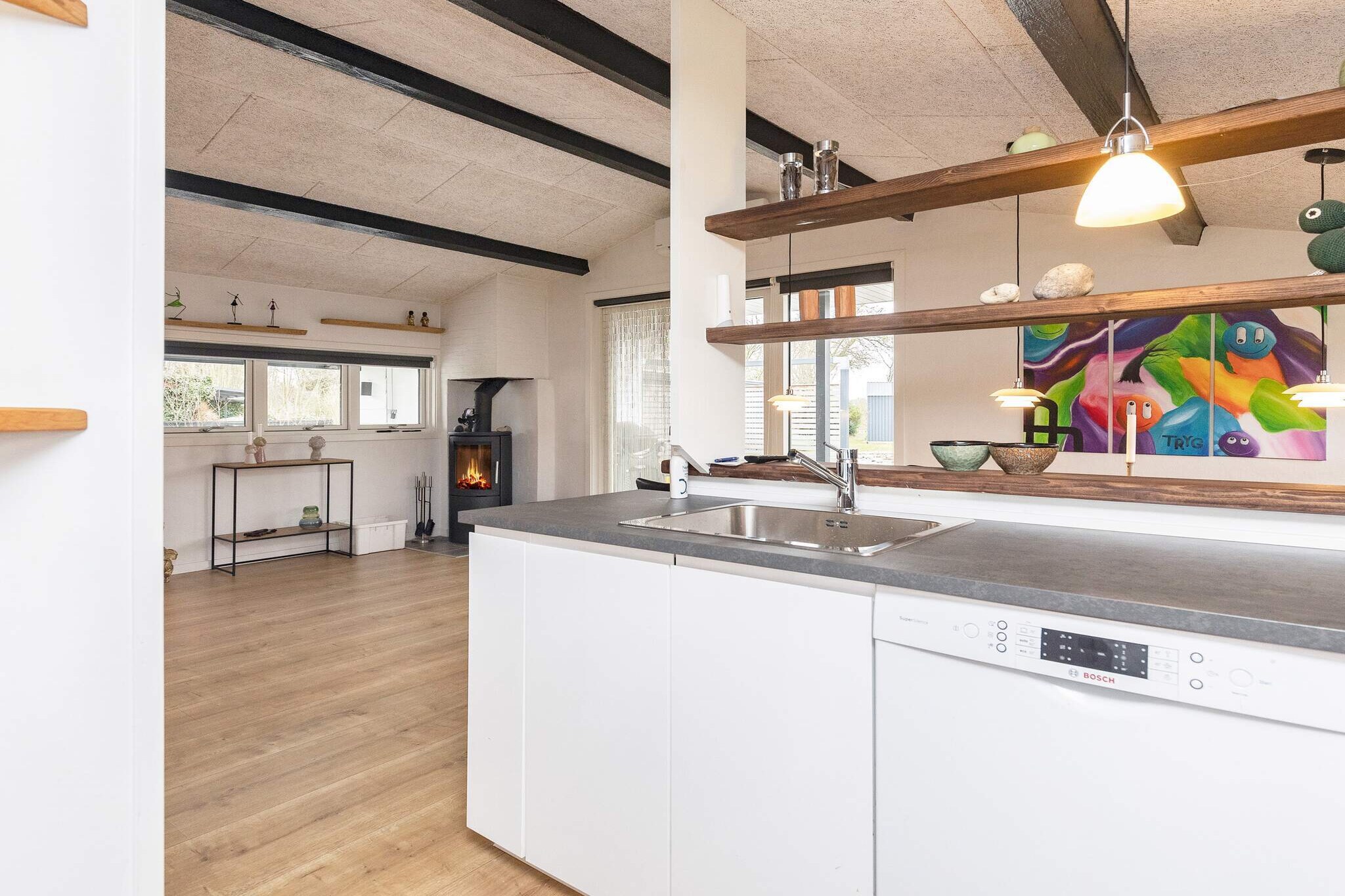 Kitchen(cooker(electric), coffee machine, dishwasher, fridge), Living/bed room(TV, stereo unit, chromecast), bedroom(double bed, children\'s bed), bedroom(2x single bed), bedroom(single bed), bathroom(washbasin, shower, toilet), heating(electric), terrace, garden furniture, sun loungers, play equipment, air to air heatpump