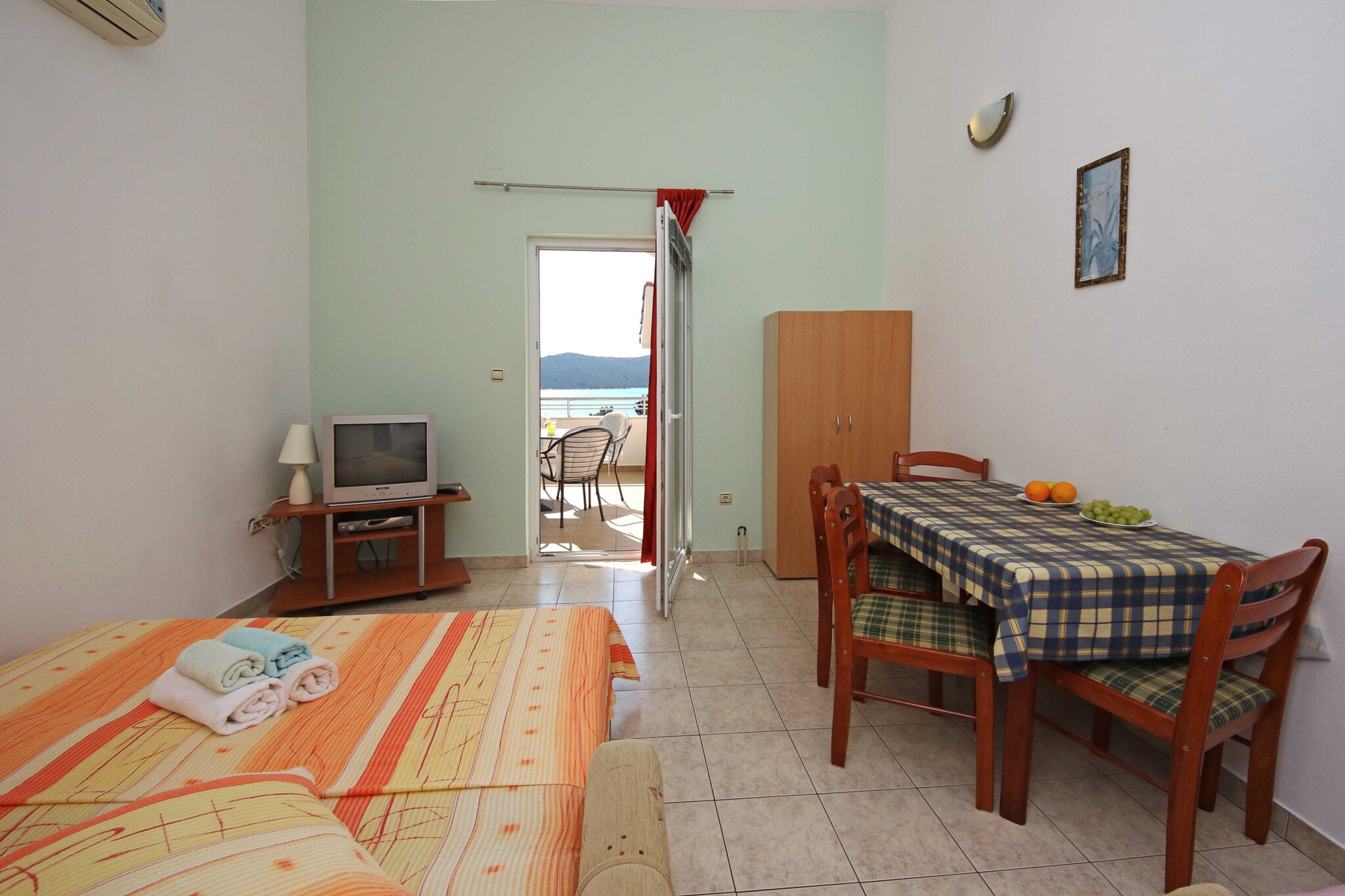 Apartments & Rooms Villa Petra is located in Žaborić, a peaceful coastal settlement only 10 km away from Šibenik.
A shared terrace fitted with outdoor furniture as well as common BBQ facilities is at your disposal.
Free private parking is provided, a reservation is not needed.
Luggage storage is possible prior to check in.
Airport shuttle as well as trips to National Parks Krka and Kornati can be organized upon request for an additional charge
This one bedroom apartment with terrace and sea view can accommodate up to four people. It features air-conditioning as well as LCD TV. The kitchenette is equipped with stove, refrigerator and kitchen utensils. The private bathroom comes with a shower and toilet. Bed linen and towels are at your disposal.
Žaborić is known for its pebble and sandy beaches as well as the long seaside promenade perfect for strolling and enjoying the sunset. The closest beach is only 70 m from the property. The grocery store is located 500 m from the property, while restaurants and bars can be found within 1 km from the property.
Apartments & Rooms Villa Petra are located only 20 km from National Park Krka and only an hour away from National Park Kornati.
Airport is located 31 km from the property.