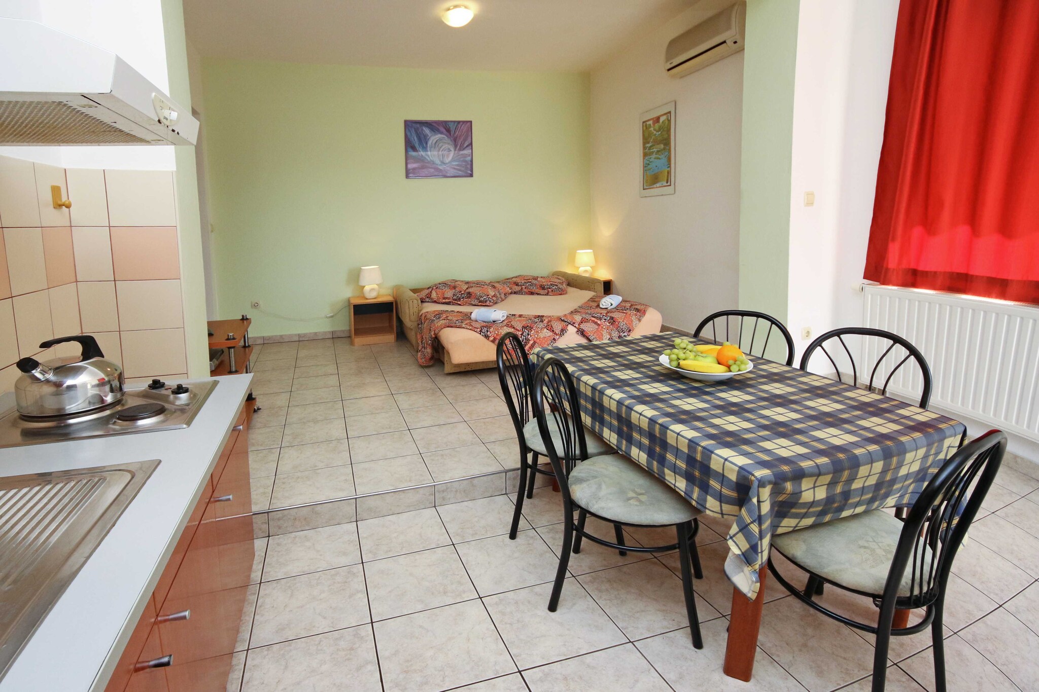 Apartments & Rooms Villa Petra is located in Žaborić, a peaceful coastal settlement only 10 km away from Šibenik.
A shared terrace fitted with outdoor furniture as well as common BBQ facilities is at your disposal.
Free private parking is provided, a reservation is not needed.
Luggage storage is possible prior to check in.
Airport shuttle as well as trips to National Parks Krka and Kornati can be organized upon request for an additional charge
This one bedroom apartment with terrace can accommodate up to four people. It features air-conditioning as well as LCD TV. The kitchenette is equipped with stove, refrigerator and kitchen utensils. The private bathroom comes with a shower and toilet. Bed linen and towels are at your disposal.
Žaborić is known for its pebble and sandy beaches as well as the long seaside promenade perfect for strolling and enjoying the sunset. The closest beach is only 70 m from the property. The grocery store is located 500 m from the property, while restaurants and bars can be found within 1 km from the property.
Apartments & Rooms Villa Petra are located only 20 km from National Park Krka and only an hour away from National Park Kornati.
Airport is located 31 km from the property.