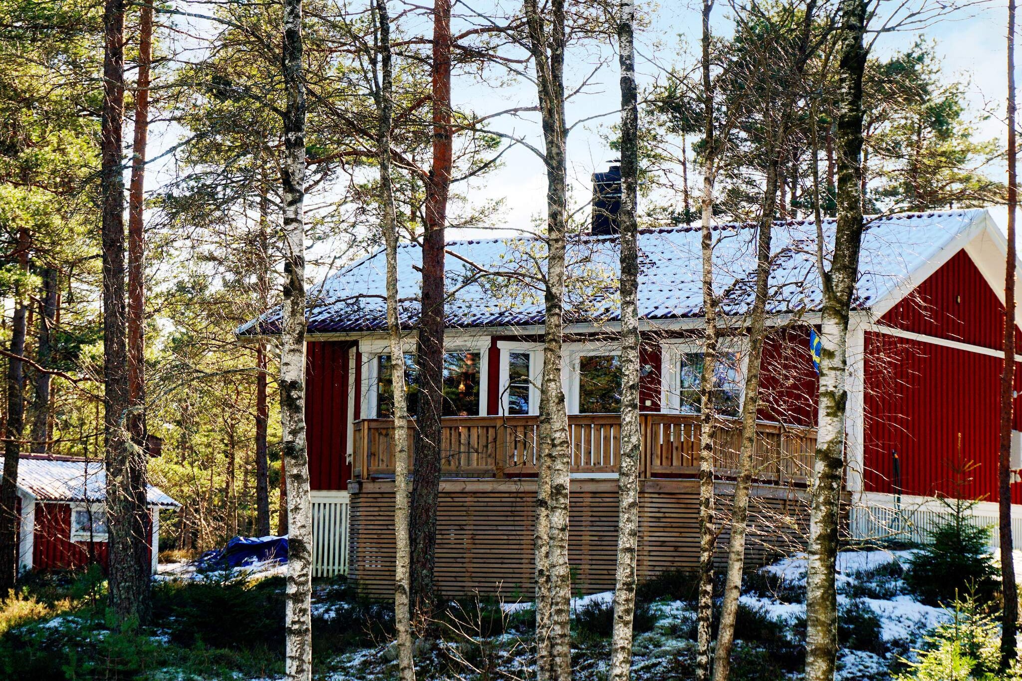 Welcome to a charming and pleasant cabin in a calm and peaceful environment where from the cabin and its balconies between the trees of the forest you have a view of part of the Kornsjöarna, a lake system that goes all the way into Norway and offers about 30 km of paddling with just two short lifts. The lakes are beautiful and rich in islands and skerries. In the other direction, the lake merges into Kynne älv, a river that ends in a fine waterfall and further into the mile-long Bullaresjöarna with its many fine swimming spots, e.g. Sundshult. The cabin is a perfect starting point for those who want to experience animals and nature, paddle, hike, cycle, rock climb, pick berries and mushrooms or go fishing (NOTE: Fishing license required). In the immediate area there is the possibility to rent canoes or you can bring your own canoe, kayak or bicycle. The area is known for its nature and wilderness experiences, there is plenty of both untouched nature and rich wildlife, don't forget your camera! In the forests, both wild animals and birds roam and you might get the chance to catch a glimpse of a moose. In late summer, there are both berries and mushrooms in the forests, for example the 35-mile-long Bohusleden hiking trail passes through the area, but you can find information about it online. The cabin is nicely located on a forest slope that faces down to the lake, via one of the cabin's balconies you reach the cabin's entrance and further into a welcoming hall. In the open kitchen there is a stove, fridge/freezer, microwave and coffee maker, in the living room there is dining room furniture, TV, a warming wood stove and sofa bed. The cottage has two bedrooms, one with a double bed and one with a bunk bed where the lower sleeping area is 120 cm wide. The bathroom has a WC, wash basin and shower. The cabin has two balcony areas with summer furniture and electric barbecue, one balcony to face the morning sun and one for evening snuggles, made for pleasant moments and conversations when you review the day's events or plan for new ones. The house has his own jetty at the lake nearby. In the area there are several excursion destinations such as Älgafallet, a magnificent waterfall with a height of 46 m, well worth a visit. The river above the falls forms the very border between Sweden and Norway. Visit the moose park in Dals Ed or take a trip across the border to Norway and Halden for a visit to Fredriksten's fortress or why not to Strömstad, a city by the sea with a large selection of activities during the summer, rich restaurant life, pleasant shopping in small shops that are close each other and if you feel like a salty, cooling dip in the summer heat, it's a short distance to the sea, cliffs and swimming, feel free to take one of the bathing boats out to one of the islands in the Strömstad archipelago. From Strömstad, there is also a ferry to the Koster Islands, Sweden's westernmost islands with a resident population. Near the cabin you will also find the Åmål ski center, which offers both cross-country and downhill skiing. Good to know: Firewood is not included. Can be bought at the nearest grocery store.