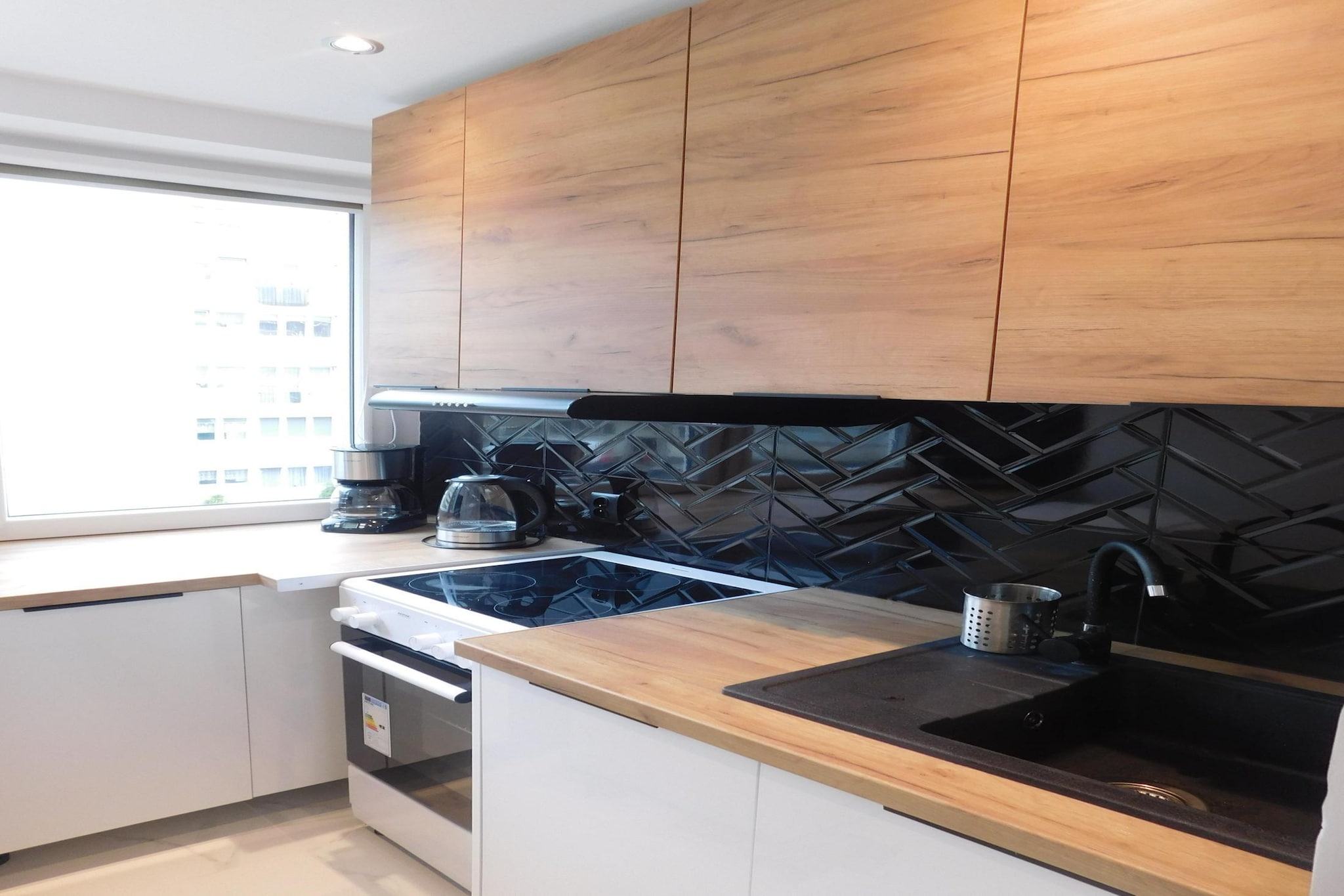 On the 2nd floor: (open kitchen(electric kettle, boiling water tap, toaster, cooker(4 ring stoves, electric), espresso machine, oven, microwave, dishwasher, fridge-freezer), Living/bed room(double sofa bed, TV(cable, german television channels), dining table), bedroom(double bed), bathroom(bath tub, washbasin, toilet, washing machine))\n\nTV, coffee machine, dishwasher, bathtub or shower, washing machine, heating, parking, lift, children\'s bed, ironing board, party games