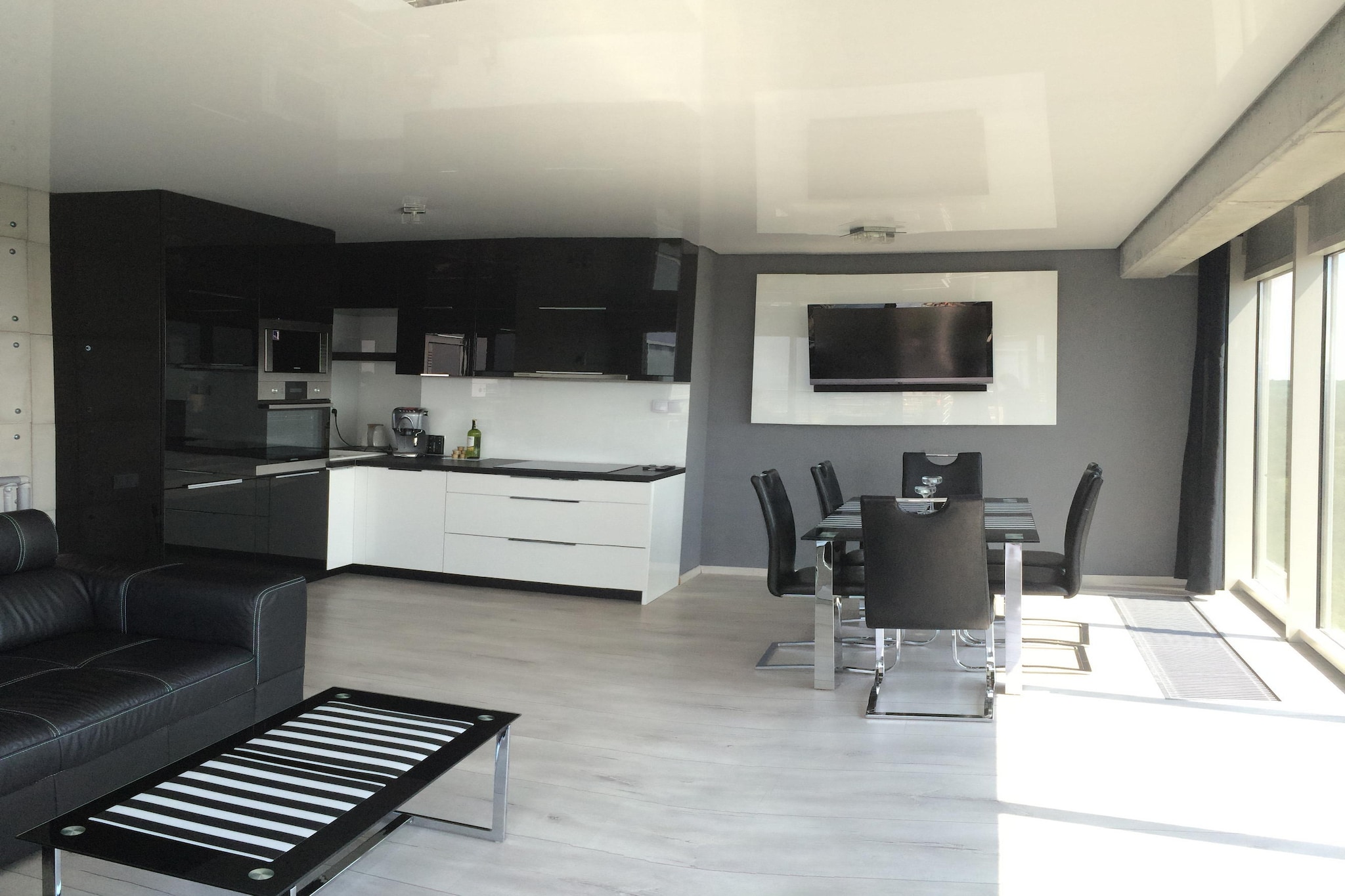 On the 11th floor: (bedroom(double bed), bedroom(small double bed), bathroom(shower, washbasin, toilet))\n\nOn the 12th floor: (open kitchen(electric kettle, boiling water tap, cooker(4 ring stoves, induction), hood, espresso machine, oven, microwave, dishwasher, fridge-freezer), Living/bed room(double sofa bed, TV, dining table))\n\nbalcony or terrace