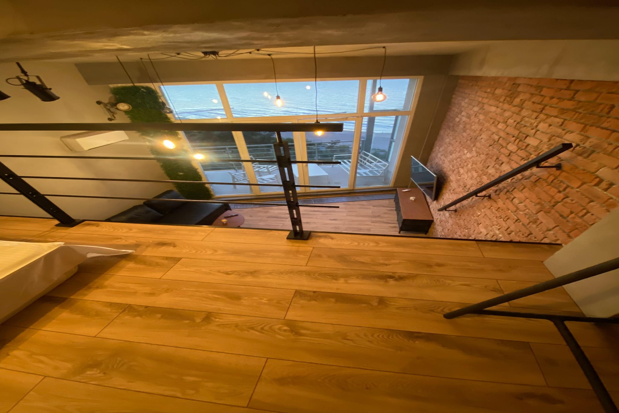 On the 11th floor: (open kitchen(electric kettle, boiling water tap, cooker, espresso machine, dishwasher, fridge), Living/bed room(double sofa bed, TV), Gallery bedroom(double bed), bathroom(shower, washbasin, toilet))\n\nbalcony