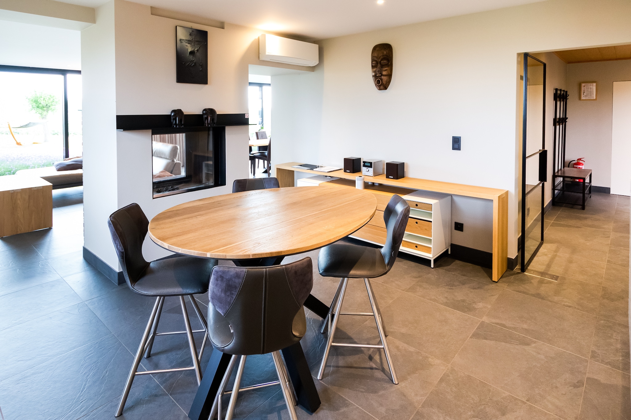 On the 1st floor: (Living room(TV, dining table, fireplace, seating area, air conditioning), Living room(dining table), Kitchen(stove, coffee machine, oven, microwave, dishwasher, fridge, freezer), bedroom(single bed, double bed, air conditioning), bedroom(single bed, double bed, air conditioning), bedroom(single bed, bunk bed, air conditioning), bedroom(single bed, air conditioning), bathroom(shower, washbasin, washing machine), bathroom(shower, washbasin))\n\nAnnex: (Kitchen, toilet)\n\nrelaxation area(Bubble bath, shower, infrared sauna, sauna), heating, terrace, garden, garden furniture, sun loungers, BBQ, parking, deckchairs, parasol, children\'s bed