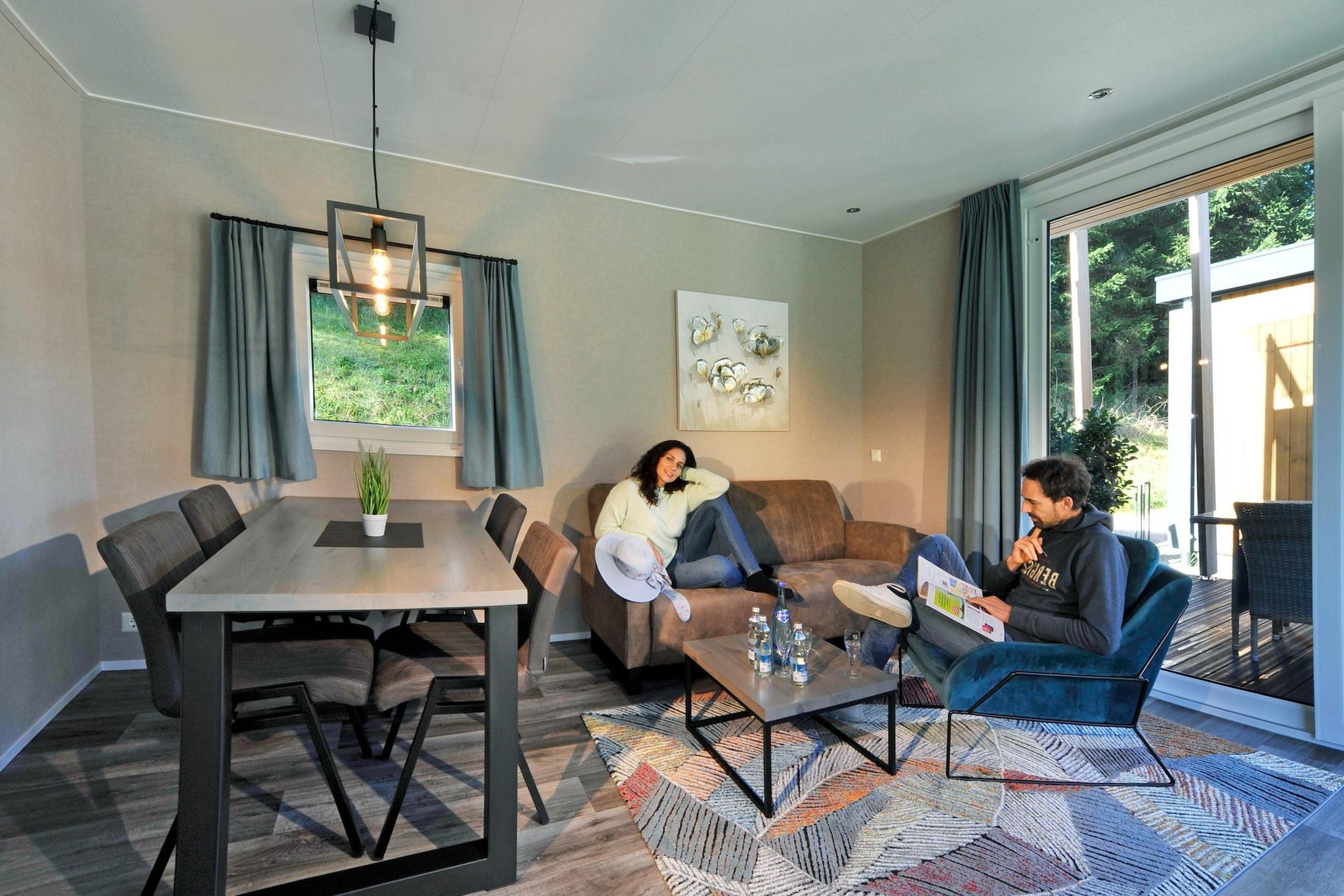 The property, along with its charming design, offers a comfortable and well-equipped holiday home, ideal for a family or small group getaway. Accommodating up to four people, it features a cozy living space with a sofa and a fully furnished balcony, perfect for enjoying outdoor meals or relaxation. The chalet provides one bedroom with a double bed, and an additional sofa bed in the living room for extra guests. Pets are welcome, ensuring your furry companions can join you. Guests can also enjoy free activities like hiking and cycling within the surrounding area.

Located in a picturesque setting, the holiday home is conveniently situated near various local attractions and transportation hubs. Just a short drive away, guests can explore charming towns and nature reserves. The nearest beach is only a 15-minute walk away, providing access to both relaxation and water sports. Visitors will find shopping areas, restaurants, and a bus stop within walking distance, while the nearest train station and airport are easily reachable within a 30-minute drive, offering seamless travel connections to nearby cities and destinations.

The property is equipped with a modern kitchen, featuring essential appliances such as a fridge, microwave, stove, and coffee machine, allowing for convenient meal preparation during your stay. Guests also have access to a well-maintained bathroom with a shower and other amenities such as free Wi-Fi to stay connected.