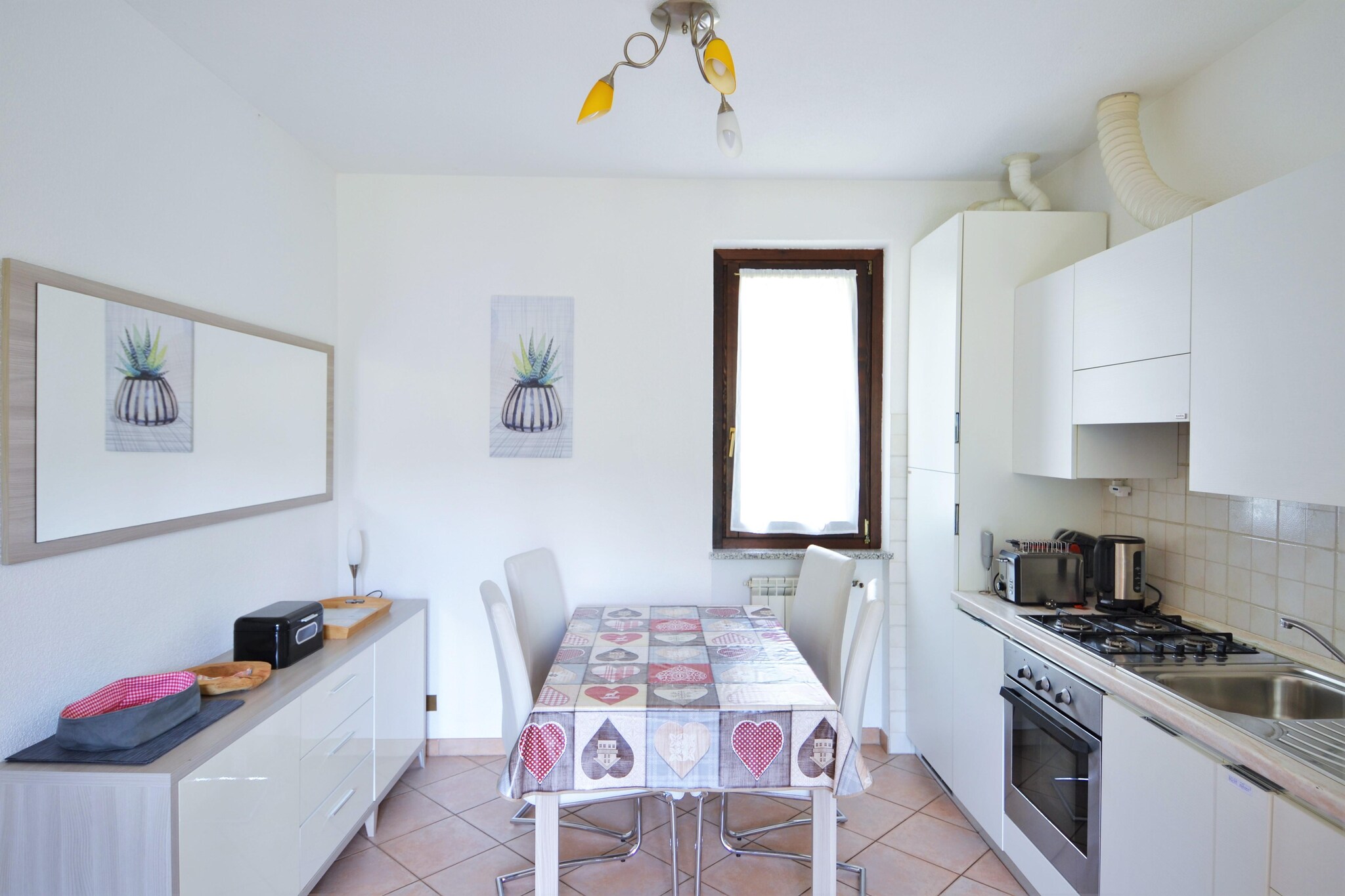 On the 1st floor: (Living room(TV, seating area), open kitchen(dining table, hob, hood, oven, fridge-freezer, washbasin), bedroom(double bed), bedroom(single bed, single bed), bathroom(washbasin, toilet, bidet, washing machine), balcony)\n\ngarden(shared with other guests), parking, swimming pool(shared with other guests, outside, opened from 1/2 May upto and including 1/2 Sep), tennis court