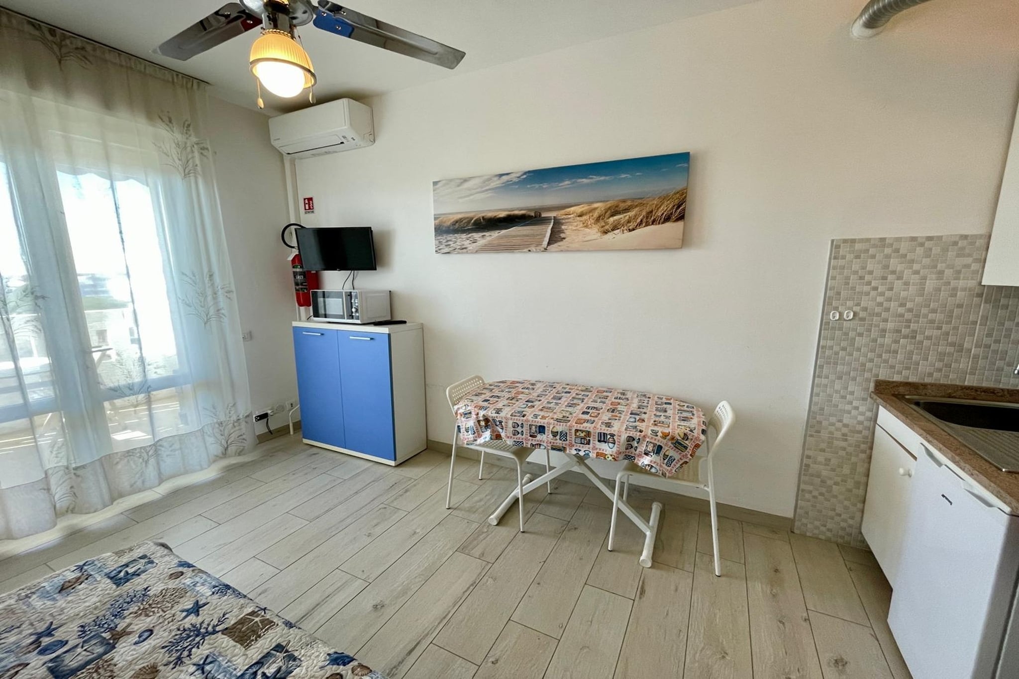 On the 5th floor: (open kitchen(hob, hood, fridge, washbasin), Living/bed room(double sofa bed, TV, dining table), bathroom(shower, washbasin, toilet, bidet), air conditioning, terrace(private))\n\ngarden(shared with other guests), parking, swimming pool(shared with other guests, outside, opened from May upto and including Sep)