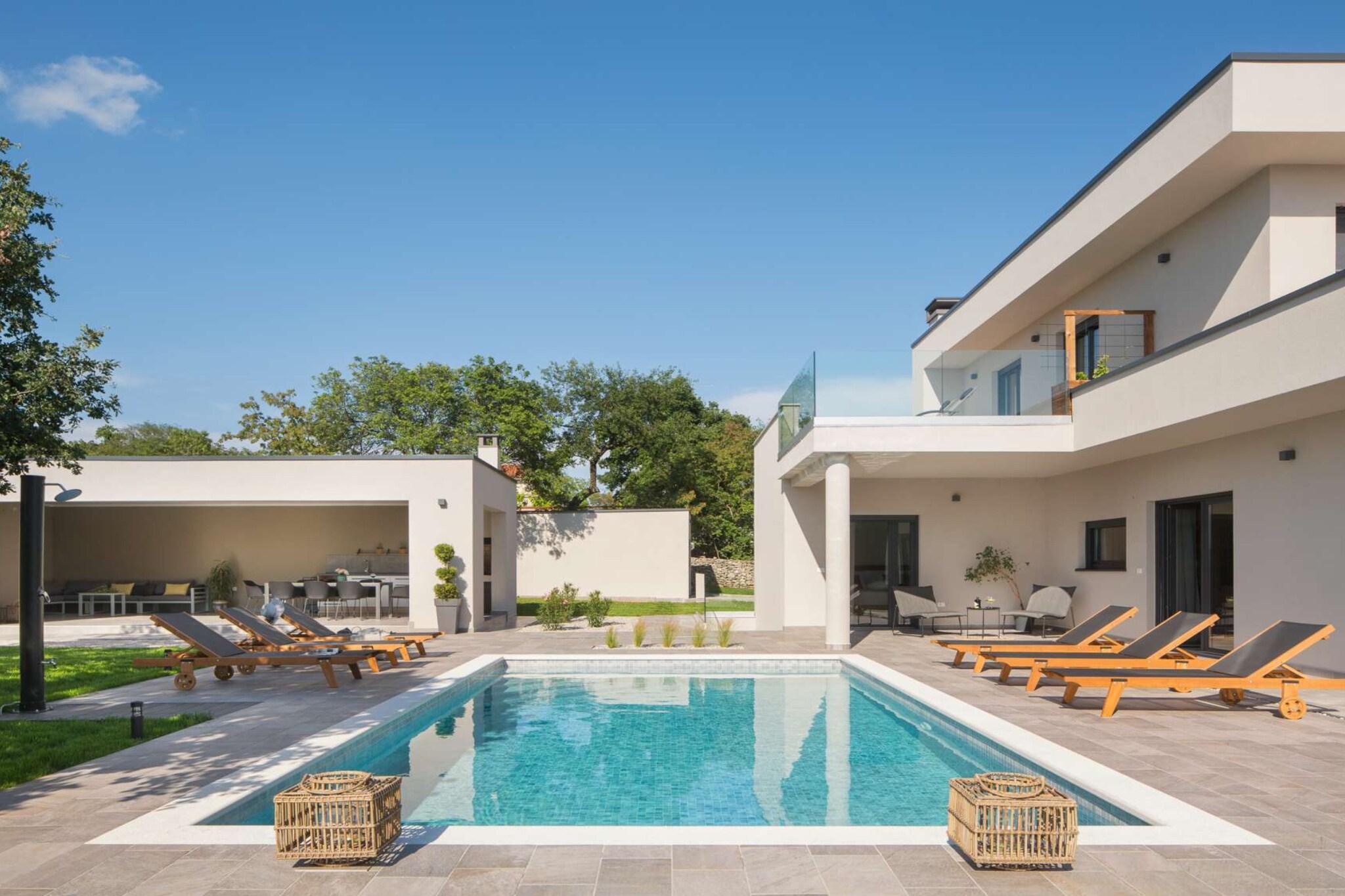 This eye-catching villa in Labin, Istria is perfect for a relaxing getaway with family or friends. Just 7 km from the beach, it features a private outdoor pool and a gym, ideal for active travelers. The spacious terrace and garden offer plenty of space to unwind, whether you're enjoying breakfast outdoors or soaking up the sun.
Labin’s historic charm is just 4 km away, where cobbled streets, cozy cafés, and panoramic views of the Adriatic await. Explore the Old Town, visit the Church of Saint Mary, or take in the scenery from the hilltop viewpoint. A supermarket is 4 km away, and local restaurants are just 2 km from the villa.
The villa includes an outdoor kitchen, balcony, and private parking. Whether you're working out, swimming, or enjoying a sunset dinner, this villa has everything you need for a memorable Istrian escape.