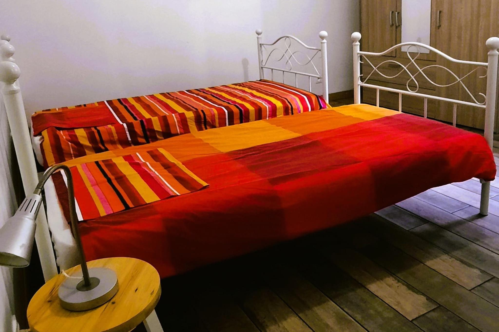 Ground floor: (Living room(TV, seating area, DVD player), open kitchen(dining table, electric kettle, toaster, hood, coffee machine, oven, microwave, dishwasher, fridge, Juicer), bedroom(single bed(90 x 200 cm), single bed(90 x 200 cm), single bed, toilet), bedroom(double bed, toilet), bathroom(shower(walk-in shower), washbasin, washbasin, toilet))\n\nfridge, terrace, garden furniture, sun loungers, BBQ, parking, parasol, swimming pool(private, heated, fenced,  6 x  3 m., opened from 1/2 Jun upto and including Sep), iron, party games