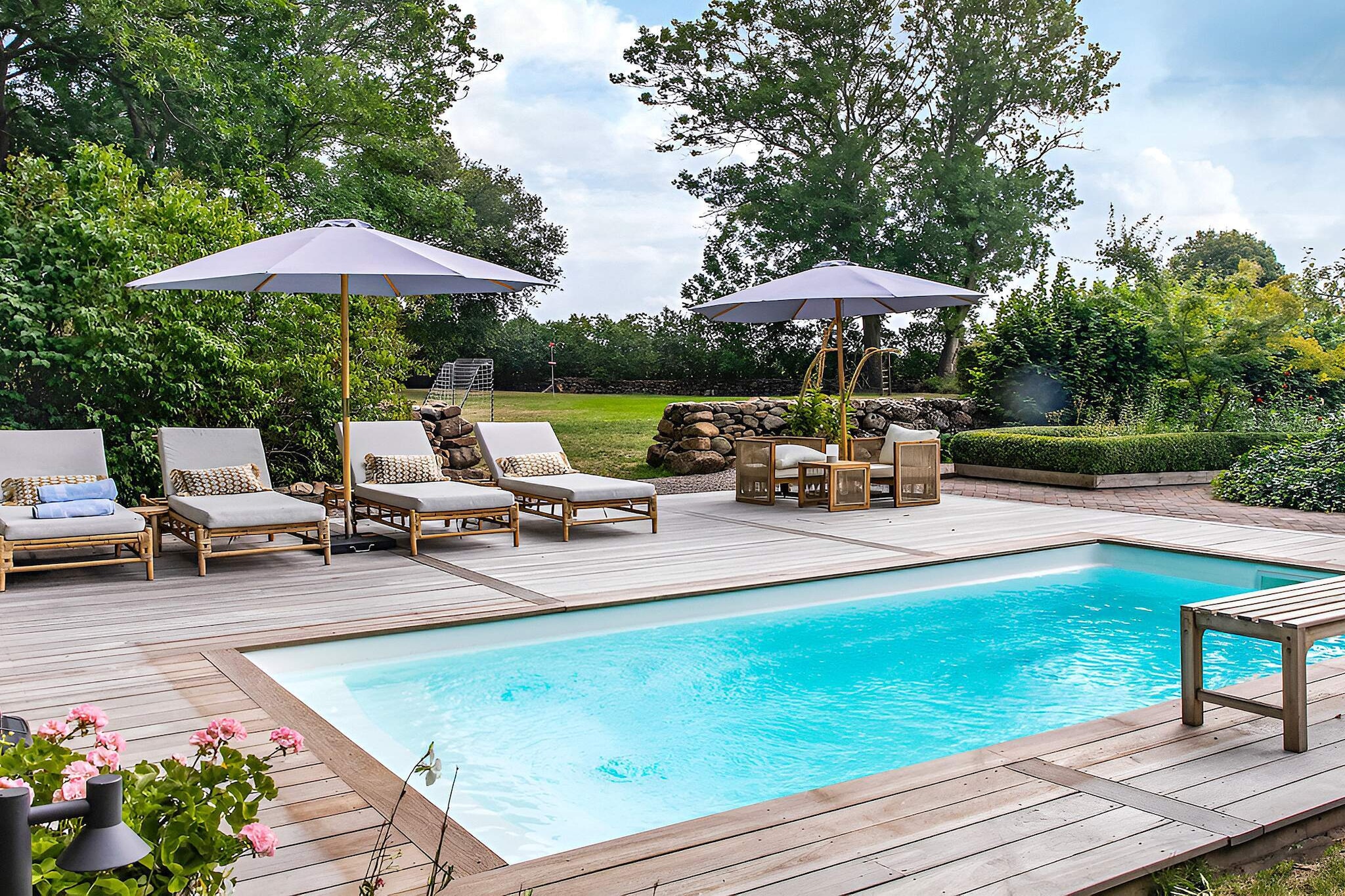 A holiday accommodation beyond the ordinary. A farmhouse furnished to the highest quality and tastefully adapted to the atmosphere of a former older residential building. You have a lovely garden and access to an outdoor pool during the summer. Here you live in the heart of the BjÃ¤re Peninsula and have a perfect starting point for visiting all the lovely beaches and harbors as well as exploring all the snack bars on BjÃ¤re. From the entrance at the back of the farmhouse via the beautiful garden you enter an open, tasteful and well-equipped kitchen with a dining area. The living room has lovely seating furniture and a large modern TV and a warming wood stove. Two of the bedrooms have a double bed and one bedroom has two single beds. The bathroom is fully tiled with a shower. The house has free wifi. Your part of the lush, lovely garden has a patio in the gazebo and a larger part with lawn that is suitable for all your activities. You have access to a lovely outdoor pool in consultation with the owner. The pool is heated from week 20 and throughout the month of August. Discover the BjÃ¤re Peninsula with all its picturesque summer villages and not least BÃ¥stad, the wonderful tennis metropolis. Discover BÃ¥stad's lovely harbor area and pay a visit to the cold bath house. There are nice cycle paths. The BjÃ¤re peninsula has become famous for its potato fields. Vegetables, meat and potato vodka are locally produced on a small scale in the many farm shops. Torekov's picturesque harbor is lined with many small restaurants. From the harbor there are ferries to Halland's VÃ¤derÃ¶. Here you will find a magically beautiful nature reserve. Ã„ngelholm offers an exciting mix of small specialty shops, exclusive boutiques and several large chains. Ã„ngelholm's Hembygdspark is an oasis for the whole family. The park houses a zoo, museum buildings and a playground for the younger ones. There are walking paths, resting and eating areas here. For those interested in fishing, there is a wide variety of sport fishing in RÃ¶nne Ã¥ and VÃ¤stersjÃ¶n. Fishing license required. There are several golf courses in the area, the closest is BjÃ¤re golf club. IMPORTANT INFORMATION: As a guest, you have access to the pool every morning until 1:00 p.m. and every other afternoon. On the afternoons that you do not have access to the pool, the homeowner will use it. The homeowner lives on another part of the plot. Your garden is separated from theirs and is located on the other side of the house, which means that you will not see or be disturbed by each other.