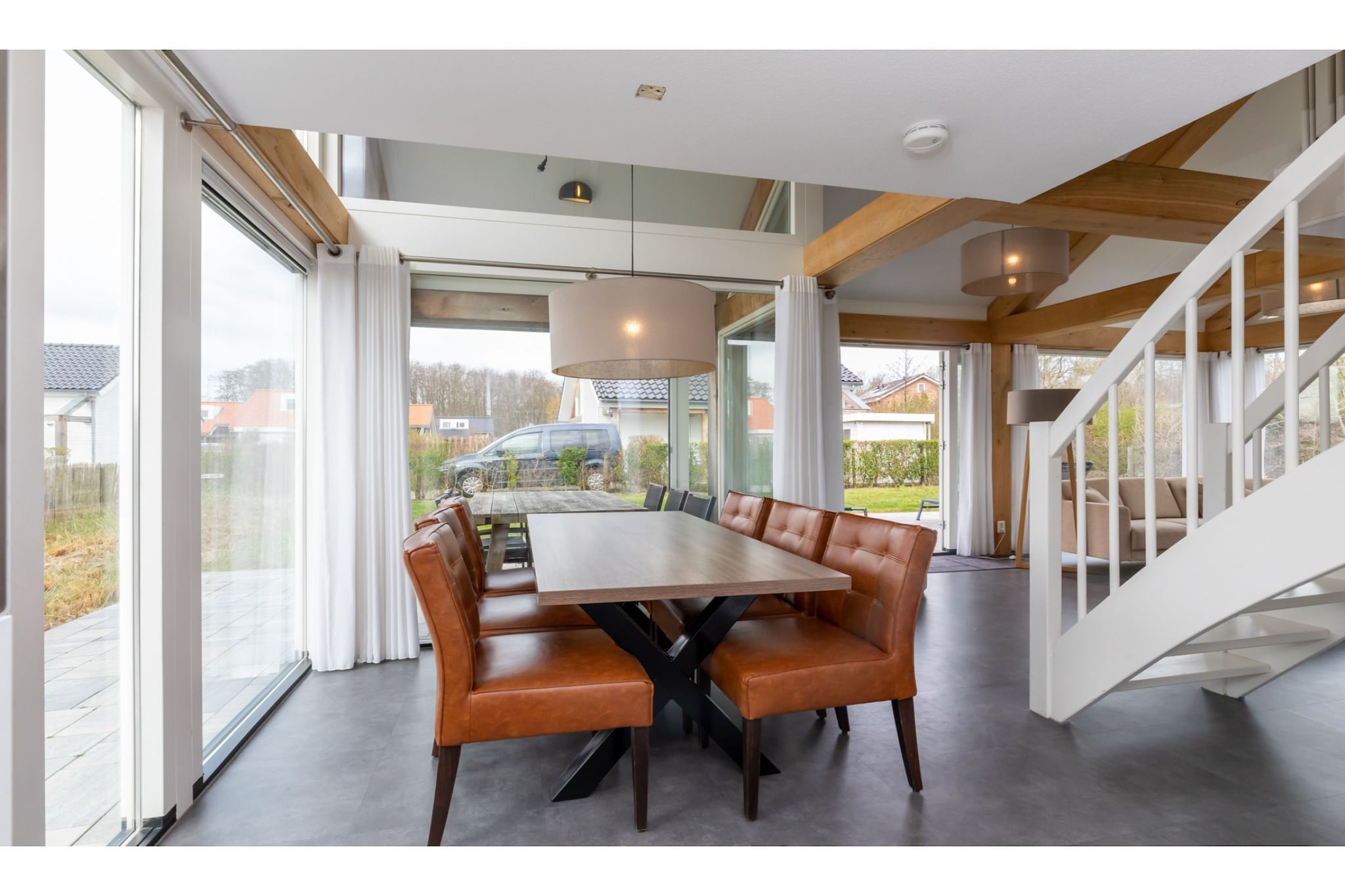 Ground floor: (hallway, open kitchen(dining table, electric kettle, cooker(gas), coffee machine(filter), combination microwave, dishwasher, fridge(+ freezer)), Living/diningroom(TV(flatscreen, international television channels), seating area), Bedroom with bathroom(2x single bed(80 x 200 cm), shower(walk-in shower), washbasin), toilet)\n\nOn the 1st floor: (bedroom(2x single bed(80 x 200 cm)), bedroom(2x single bed(80 x 200 cm)), bathroom(shower(walk-in shower), washbasin), toilet)\n\ntumble dryer, camping cot, washing machine, heating(floor heating), terrace, garden, garden furniture, parking, high chair