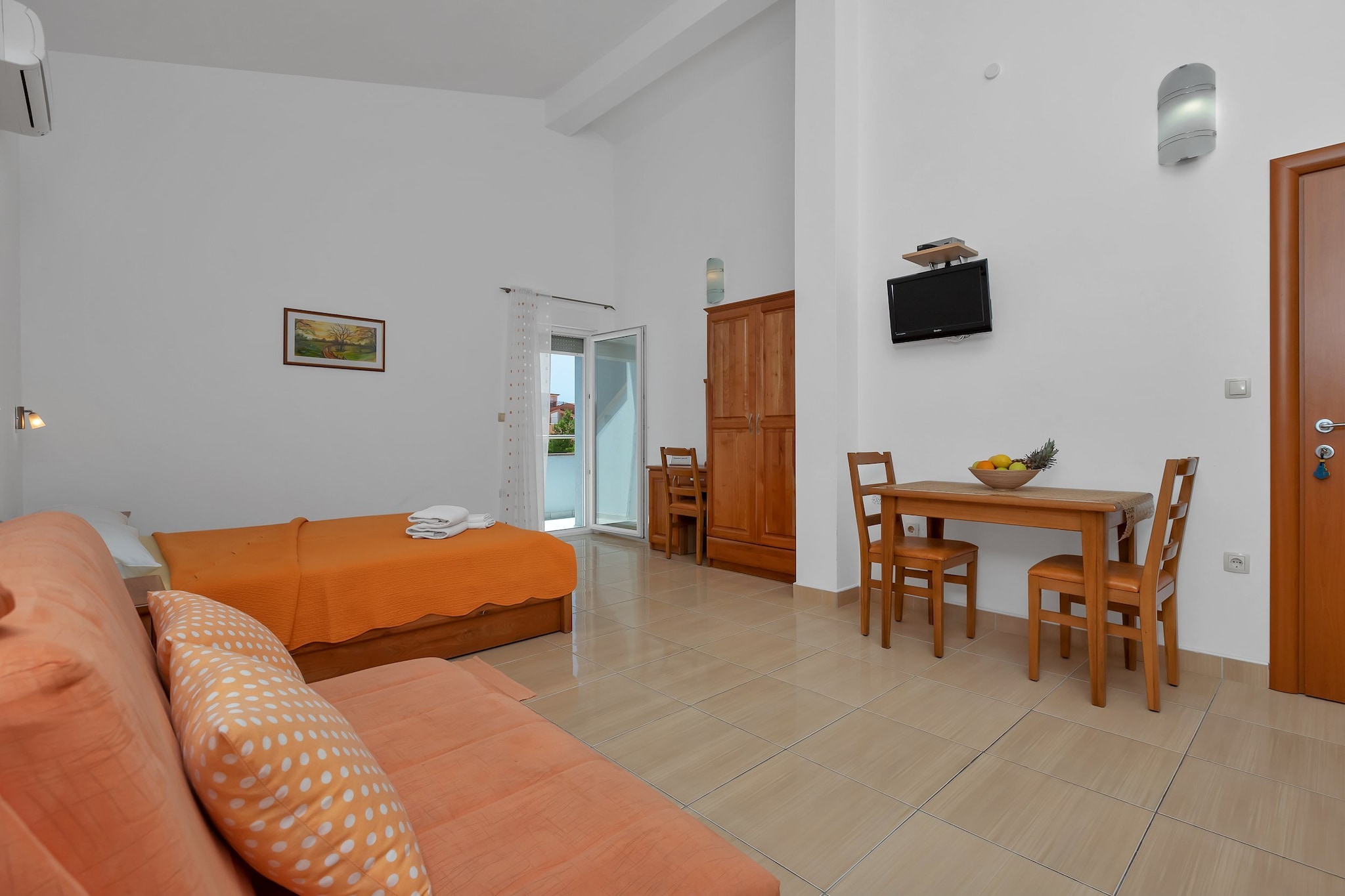 Apartments Villa Juric are located in a small town called Baška Voda, only 12 km from Makarska. 

Common BBQ grill as well as an outdoor dining area are at your disposal. All the units have a private furnished balcony.

Free private parking is provided, reservation is not needed.

Luggage storage is possible prior to check in and after check out, so you can explore the city a little more before your departure. 

A baby cot is available upon request.

This studio apartment can accommodate up to three people. It features air-conditioning as well as LCD TV. Kitchenette is equipped with refrigerator, water kettle, freezer, coffee maker, kitchen utensils and dining area. The private bathroom comes with a shower and toilet. Bed linen and towels are provided.

This location is perfect for guests who love to enjoy the sun and the sea, want to  avoid the crowds, enjoy the peace and keep the privacy. Due to the properties good location everything you may need during your holiday can be found in the area. Restaurants and bars  can be found within 100 m radius from the property. Beach is only 400 m from Apartments Villa Juric. Market is situated only 100 m from the property.

Split airport is 24 km from the property, while bus station for local buses is only 70 m away.