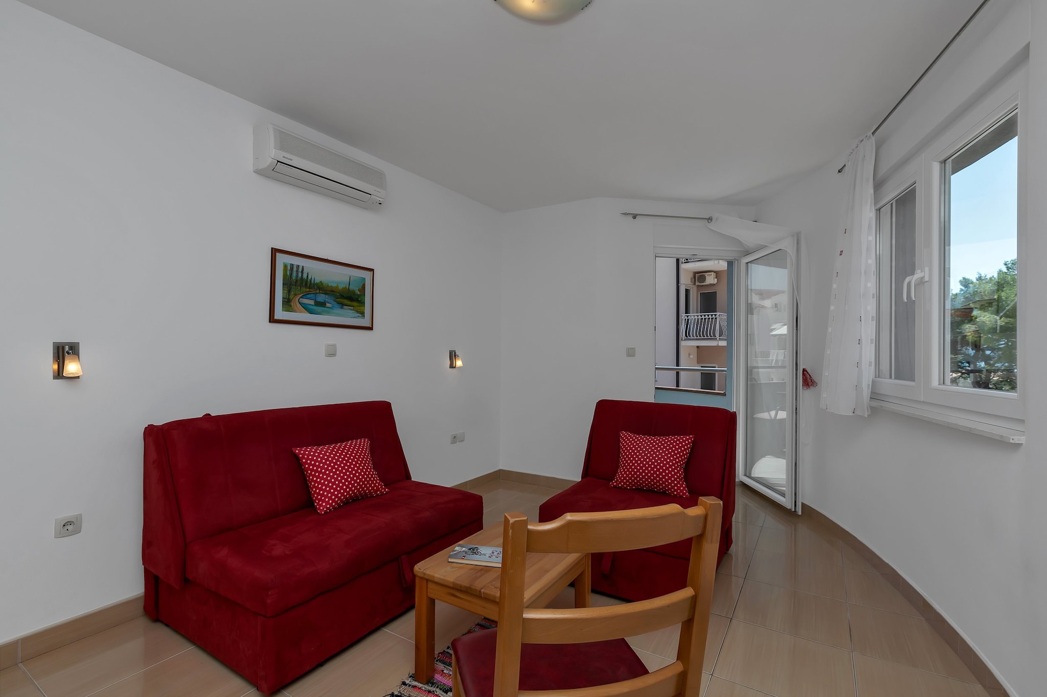Apartments Villa Juric are located in a small town called BaÅ¡ka Voda, only 12 km from Makarska. 

Common BBQ grill as well as an outdoor dining area are at your disposal. All the units have a private furnished balcony.

Free private parking is provided, reservation is not needed.

Luggage storage is possible prior to check in and after check out, so you can explore the city a little more before your departure. 

A baby cot is available upon request.

This one bedroom apartment  can accommodate up to four people. Living room is fitted with sofa, air-conditioning as well as LCD TV. Kitchenette is equipped with refrigerator, water kettle, freezer, coffee maker, kitchen utensils and dining area. The private bathroom comes with a shower and toilet. Bed linen and towels are provided.

This location is perfect for guests who love to enjoy the sun and the sea, want to  avoid the crowds, enjoy the peace and keep the privacy. Due to the properties good location everything you may need during your holiday can be found in the area. Restaurants and bars  can be found within 100 m radius from the property. Beach is only 400 m from Apartments Villa Juric. Market is situated only 100 m from the property.

Split airport is 24 km from the property, while bus station for local buses is only 70 m away.