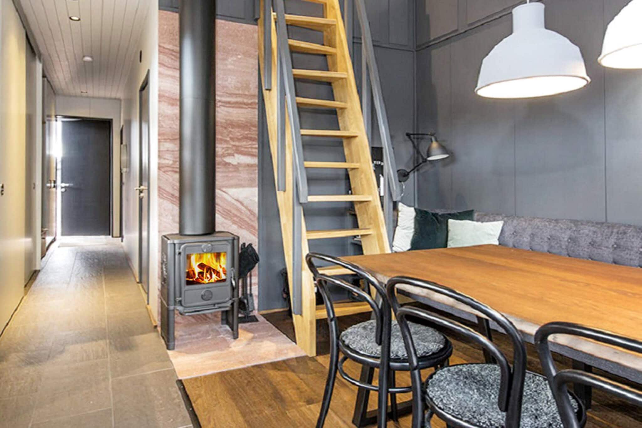 Kitchen(cooker(electric), hood, coffee machine, microwave, dishwasher, fridge-freezer), bedroom(2x bunk bed), bathroom(floor heating)(washbasin, shower, toilet, washing machine, drying cabinet), mezzanine(single bed, double bed), single folding bed, sauna(indoor, 3 persons), heating(electric), garden furniture, parking