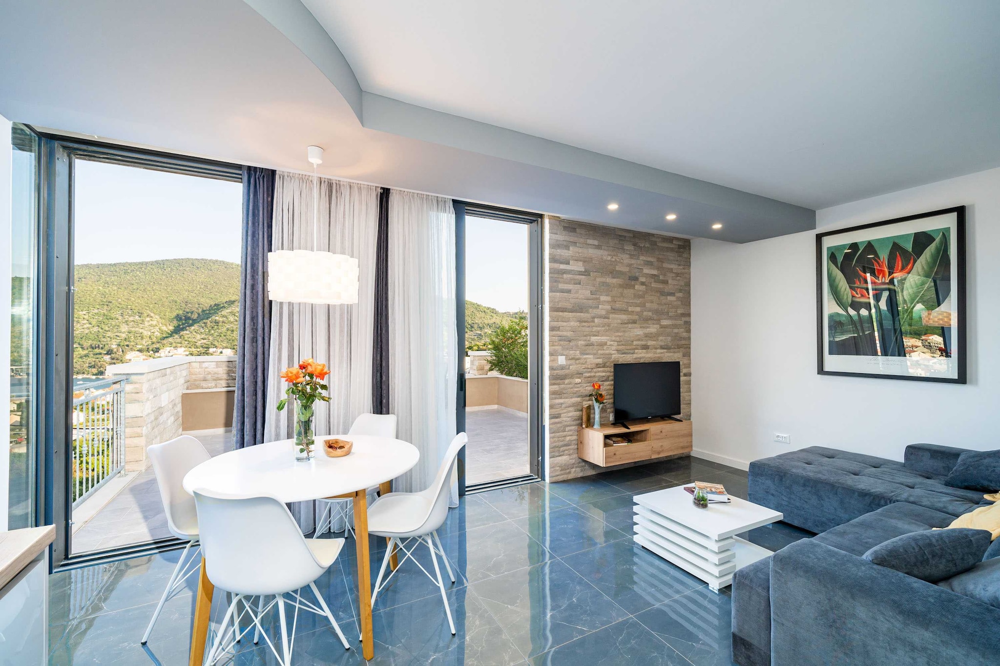 Apartments Villa Arcadia is located in quite residential area, 10 km from famous Old Town of Dubrovnik.
Shared swimming pool as well as terrace that offers a breathtaking view on the mountains and river Ombla are at your disposal. You will aslo have access to BBQ grill and an ooutdoor dining area.
Private parking is provided.
* Swimming pool is available from 01.05.-1.11. The period is changeable and it depends on the weather. Pool is shared with other guests from other apartment.
This one bedroom apartment with terrace can accommodate up to three people. It features air-conditioning, free Wi-fi and Internet enabled & SAT TV. The open space living room comes with sofa and sitting area, and it's combined with the equipped kitchen and dining area. The private bathroom comes with shower and toilet. Free toiletries, bed linen as well as towels are at your disposal.
Apartments Villa Arcadia is located in Mokošica, suburban residential area of Dubrovnik, approximately 10 km from historical Old Town. Surrounded by mountains, Ombla river and Adriatic sea, it is a perfect place for a peaceful holiday. Various cafe bars, grocery store and bus station can be reached in 5 minute walk. Bus lines run frequently to the Old Town where guests can explore famous sights such as the City Walls, St. Blaise Church, Rector's Palace and many more that this UNESCO heritage site offers or relax at one of the many cafes and restaurants.
Dubrovnik airport is 25 km from the Apartments Villa Arcadia.