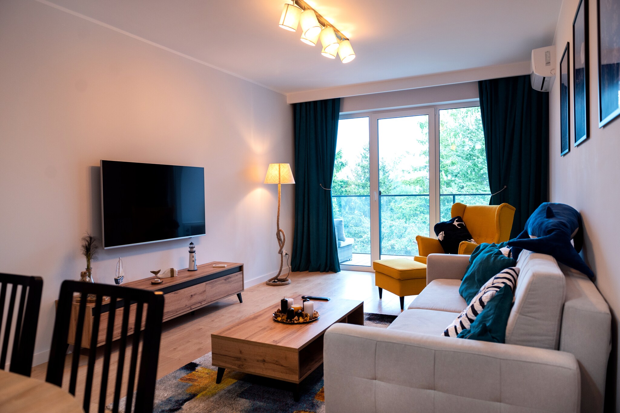On the 2nd floor: (open kitchen(hob(2 ring stoves, induction), electric kettle, toaster, hood, coffee machine, oven, dishwasher, fridge-freezer), Living/diningroom(double sofa bed, TV(flatscreen), dining table(4 persons)), bedroom(double bed, TV(flatscreen)), bathroom(shower, washbasin, toilet, washing machine, hairdryer))\n\nInternet access, Parking, Whirlpool, Massage, Fitness, Play area, sauna(shared with other guests), balcony, heating(central, through air conditioning), air conditioning, garden furniture, sun loungers, swimming pool(shared with other guests, heatable, indoor, including separate children’s swimming pool (depth 50cm)), sand pit(shared with other guests), slide(shared with other guests), lift, ironing board, iron, Swing set