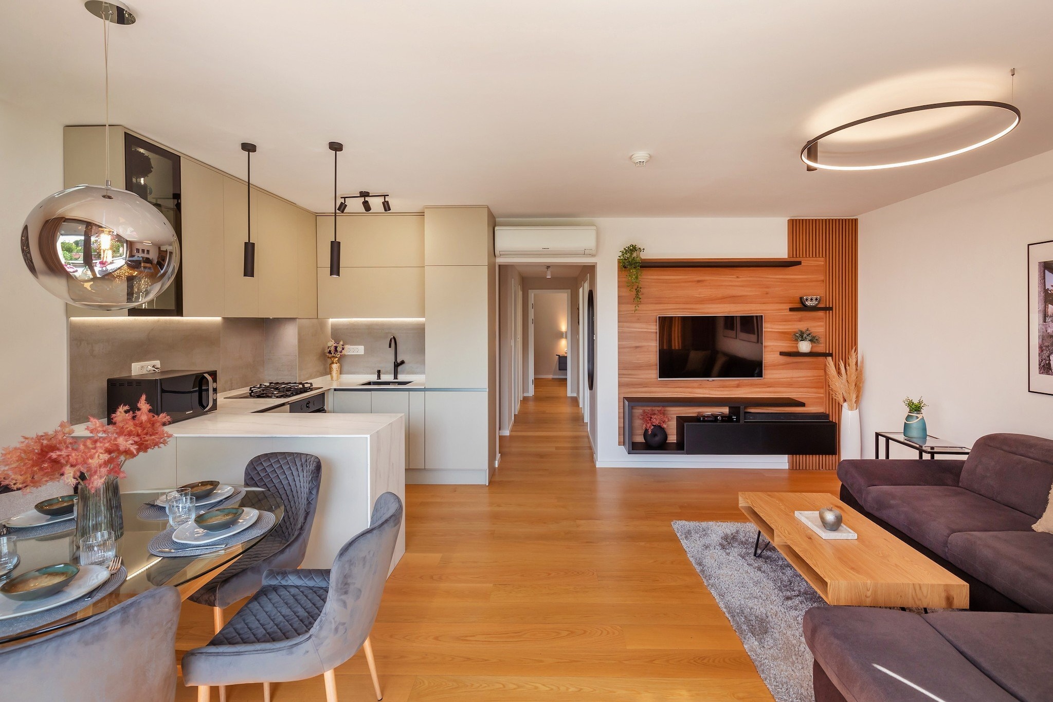 On the 6th floor: (Living room, Kitchen, bedroom(double bed), bedroom(small double bed), bedroom(single bed), bathroom(toilet, shower))\n\ndining room, garage, TV, dining table, stove, seating area, electric kettle, oven, microwave, dishwasher, fridge, freezer, cot, washing machine, balcony, air conditioning, parking, ironing board, iron, hairdryer