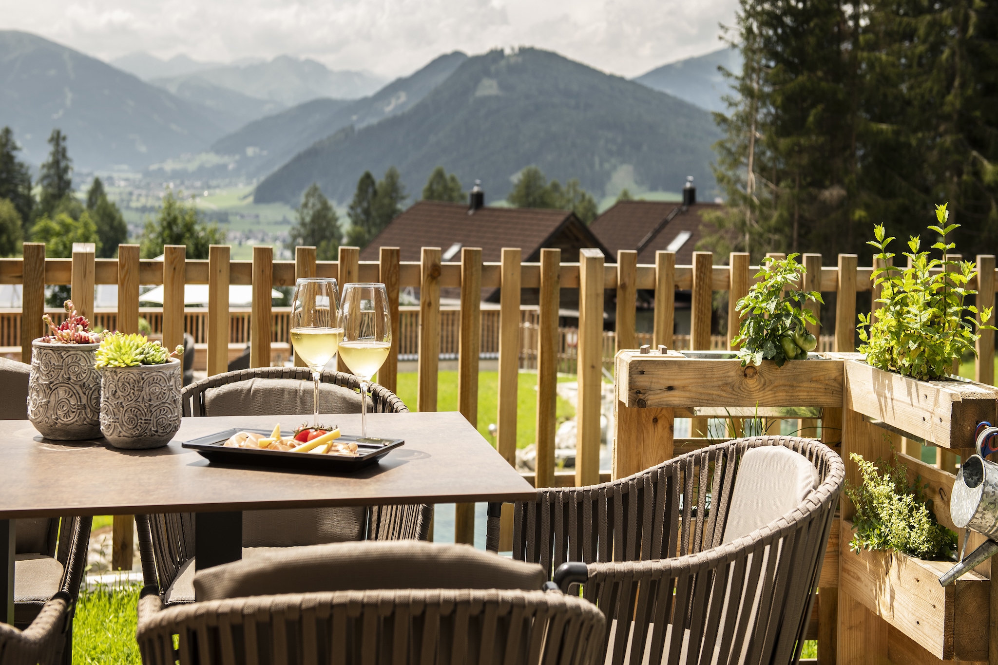 Ground floor: (Living room(TV, seating area), Kitchen(cooker(4 ring stoves, ceramic), coffee machine(cups), oven, dishwasher, fridge-freezer, washbasin), bedroom(double bed), bedroom(double bed), bathroom(washbasin, toilet), bathroom(washbasin, toilet), bathroom(shower, washbasin), bathroom(bath tub, shower))\n\nsauna, terrace, garden, BBQ, parking, swimming pool(natural swimming pond)