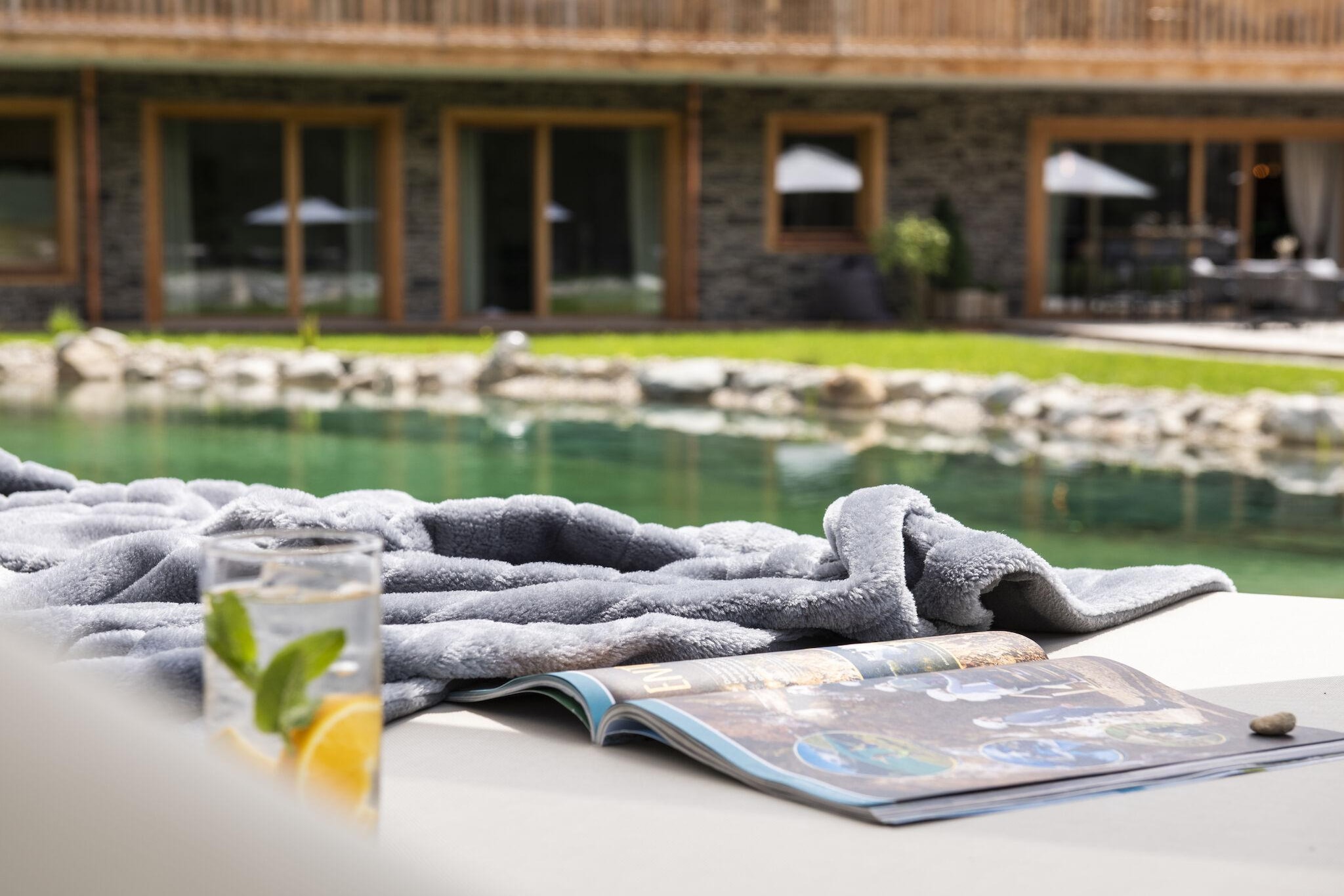 With elegant and high-quality interiors, this spacious chalet in Wölting offers a wonderful stay! Surrounded by greenery and mountains, the chalet features a private swimming natural pond where you can enjoy a refreshing dip. As the day passes by, you can relax in the sauna. Ideal for a large group of friends and families, there is never a dull moment here!
The centre of Tamsweg is 1.6 km away where you can go shopping and explore the region. Try the different delicacies in the nearby restaurants. You can also cycle and go mountain biking in the region. There are many other interesting sights that are also worth a visit.
The chalet is beautifully made and has a well-equipped kitchen for preparing delicious meals. You can also spend time on the terrace enjoying your barbecue meals. The garden is a perfect place to destress with a book. Parking is available on the premises.
Please note that the bunk beds in bedrooms are smaller than normal, so it is recommended for children.
About Belvilla
When you stay in a Belvilla home, you can rest assured of a unique holiday home in ideal surroundings at an attractive price. The portfolio of accommodations consists of more than 40,000-holiday homes in 20 European countries. Interested in a weekend getaway, a summer or winter sports holiday or simply a short break? Do you prefer the coast, the countryside or the mountains? Whatever your preference, there is a Belvilla home to meet your needs, from a cosy gîte for two to a castle big enough for the entire family, from an apartment in the heart of Rome to a cabin in the middle of nowhere, from a simple tree house to a luxury dream villa and from close to home to the other side of Europe.
A Belvilla home gives you the freedom to enjoy breakfast in your pyjamas or continue a good conversation into the morning hours without having to worry about the bar's closing time. Prepare gourmet meals with fresh local ingredients in your own kitchen and take advantage of having your own swimming pool to do as many cannonballs as you want! In other words, you can enjoy complete privacy in your home away from home.