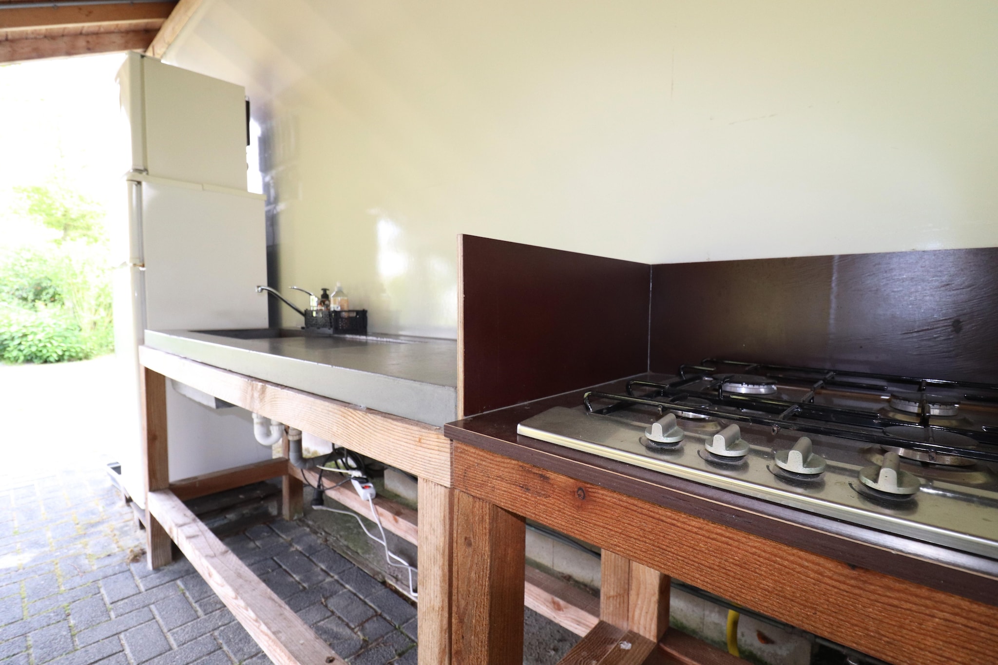 Ground floor: (Living room(seating area), open kitchen(wood cooker), bedroom(double bed), bathroom(shower, washbasin, toilet))\n\nKitchen(shared with other guests)(hob, fridge), terrace, garden, garden furniture