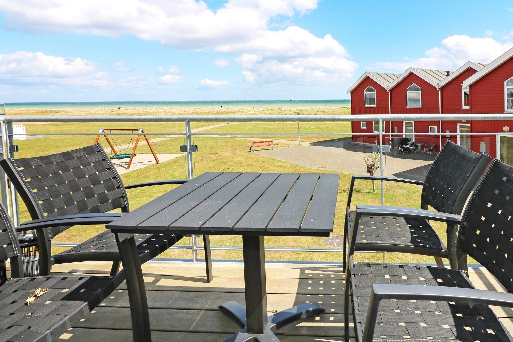 This holiday apartment offers stunning sea views and an excellent location directly on the child-friendly beach in Øster Hurup. Situated near the harbor and within walking distance of the town’s restaurants, cafés, shops, and other attractions, it is an ideal choice for families seeking a relaxed seaside holiday with easy access to local activities. The apartment is part of a row house and features a well-equipped kitchen and a dining area, seamlessly connected to a spacious ground-floor living room. From here, you can step out onto a terrace with panoramic sea views, perfect for enjoying morning coffee, evening meals, or simply relaxing while watching the waves. The ground floor also includes a bathroom with a shower, toilet, and washing machine for added convenience. Upstairs, the apartment offers a bedroom with a double bed and an additional living space with a sofa bed. This upper-level room opens onto a balcony that provides more breathtaking sea views, letting you enjoy the coastline from multiple vantage points. Outside, the property offers large shared green areas where children can safely play and enjoy games. The combination of indoor comfort, outdoor space, and immediate beach access creates the perfect environment for a memorable family holiday. The apartment allows one pet, making it suitable for families who want to bring a furry friend along. Its convenient location, cozy interior, and beautiful surroundings ensure a relaxing and enjoyable stay for guests of all ages. No rental to youth groups.