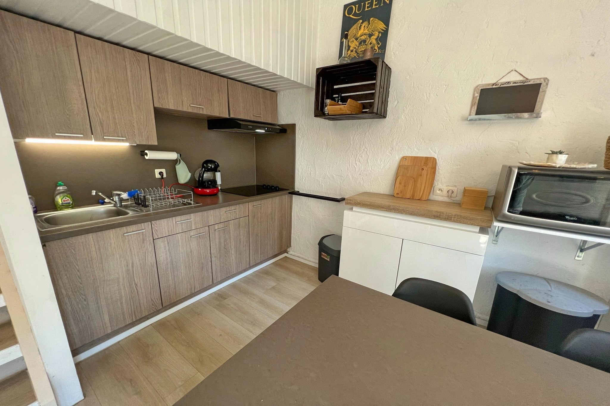 Ground floor: (open kitchen(double sofa bed, coffee machine(cups), combination microwave, fridge-freezer), Living/diningroom(TV(cable), dining table, stove(wood), seating area), bedroom(double bed, washbasin), bedroom(bunk bed, washbasin), bathroom(shower, toilet))\n\nheating(electric), terrace, garden furniture, garden furniture, parking