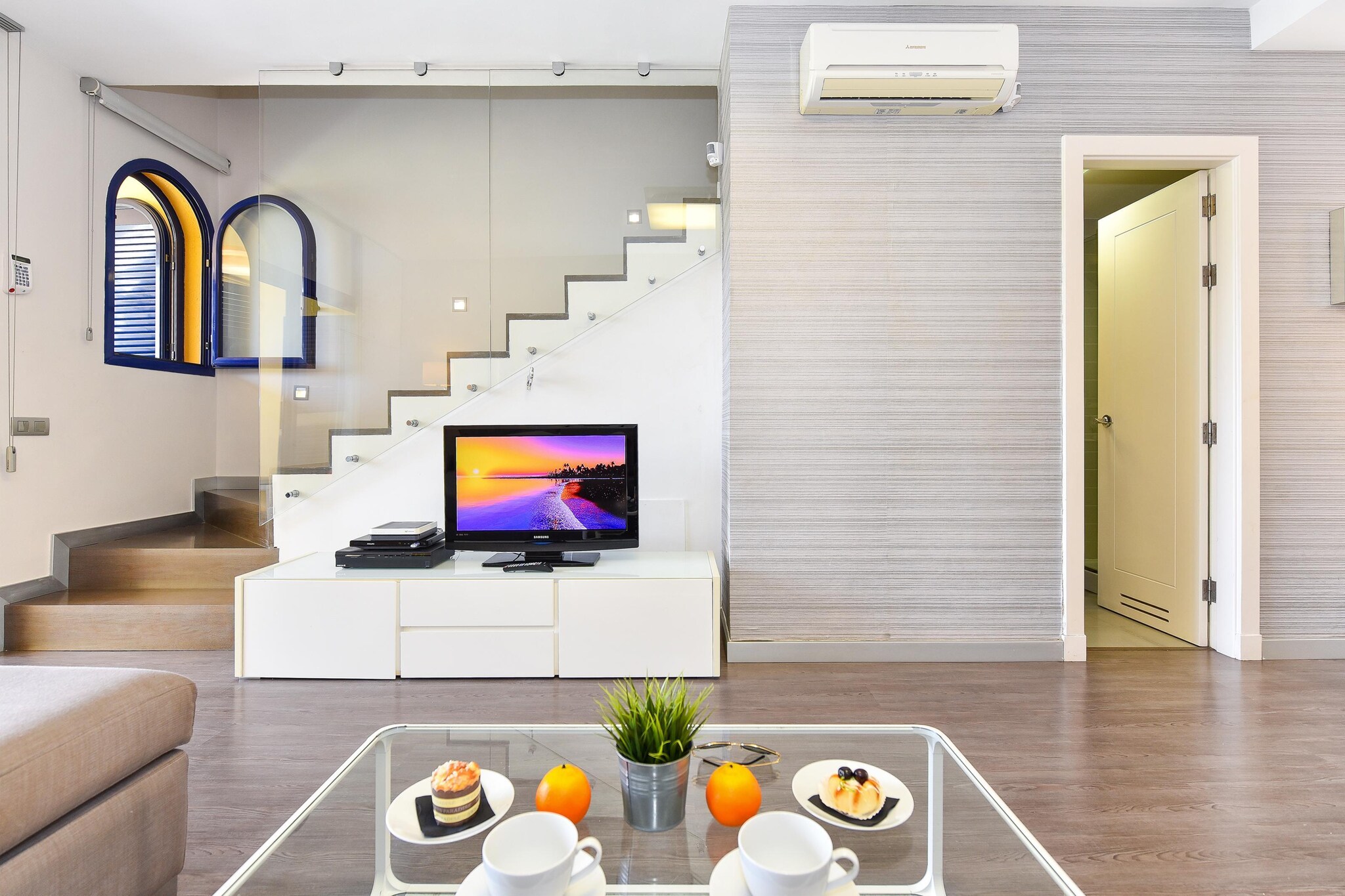 Ground floor: (open kitchen(toaster, cooker(ceramic), coffee machine, oven, microwave, dishwasher, fridge-freezer, washing machine), Living/diningroom(TV, dining table, seating area, air conditioning), bathroom(shower))\n\nOn the 1st floor: (bedroom(double bed, balcony), bedroom(2x single bed), bathroom(shower))\n\npatio, terrace, garden, garden furniture, swimming pool(shared with other guests)