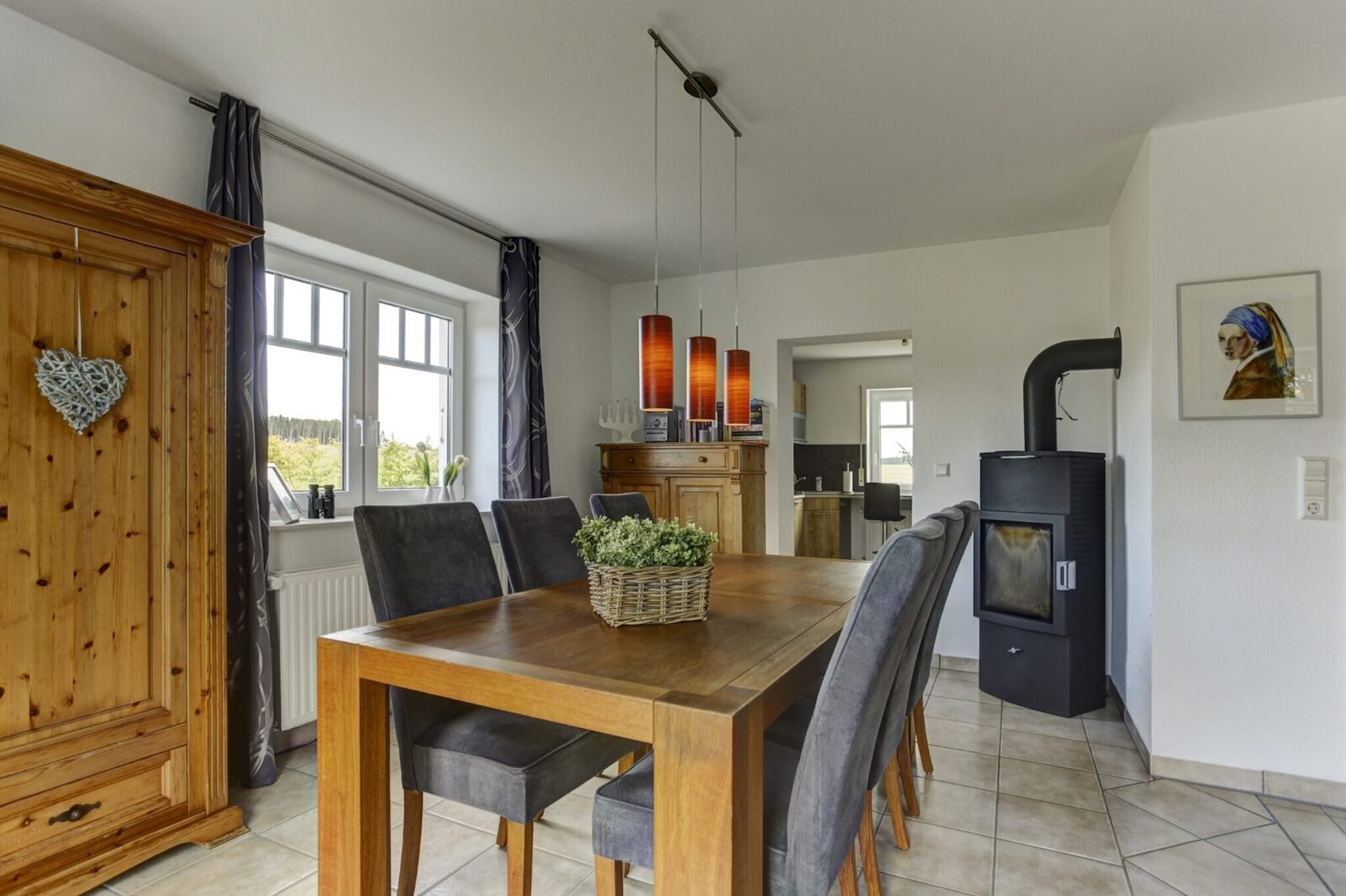 Ground floor: (Entrance, hall, Kitchen(electric kettle, toaster, cooker(induction), coffee machine(filter, pads), oven, combination microwave, dishwasher, fridge(+ freezer)), Living/diningroom(TV(flatscreen), dining table, fireplace, seating area), toilet(washbasin))\n\nOn the 1st floor: (bedroom(single bed, single bed), bedroom(double bed), bedroom(double bed), bathroom(bath tub, shower(walk-in shower), washbasin, toilet))\n\n2x Parking, tumble dryer, cot, washing machine, terrace(roofed), garden, garden furniture, BBQ, high chair, party games, Garden shed, Swing set