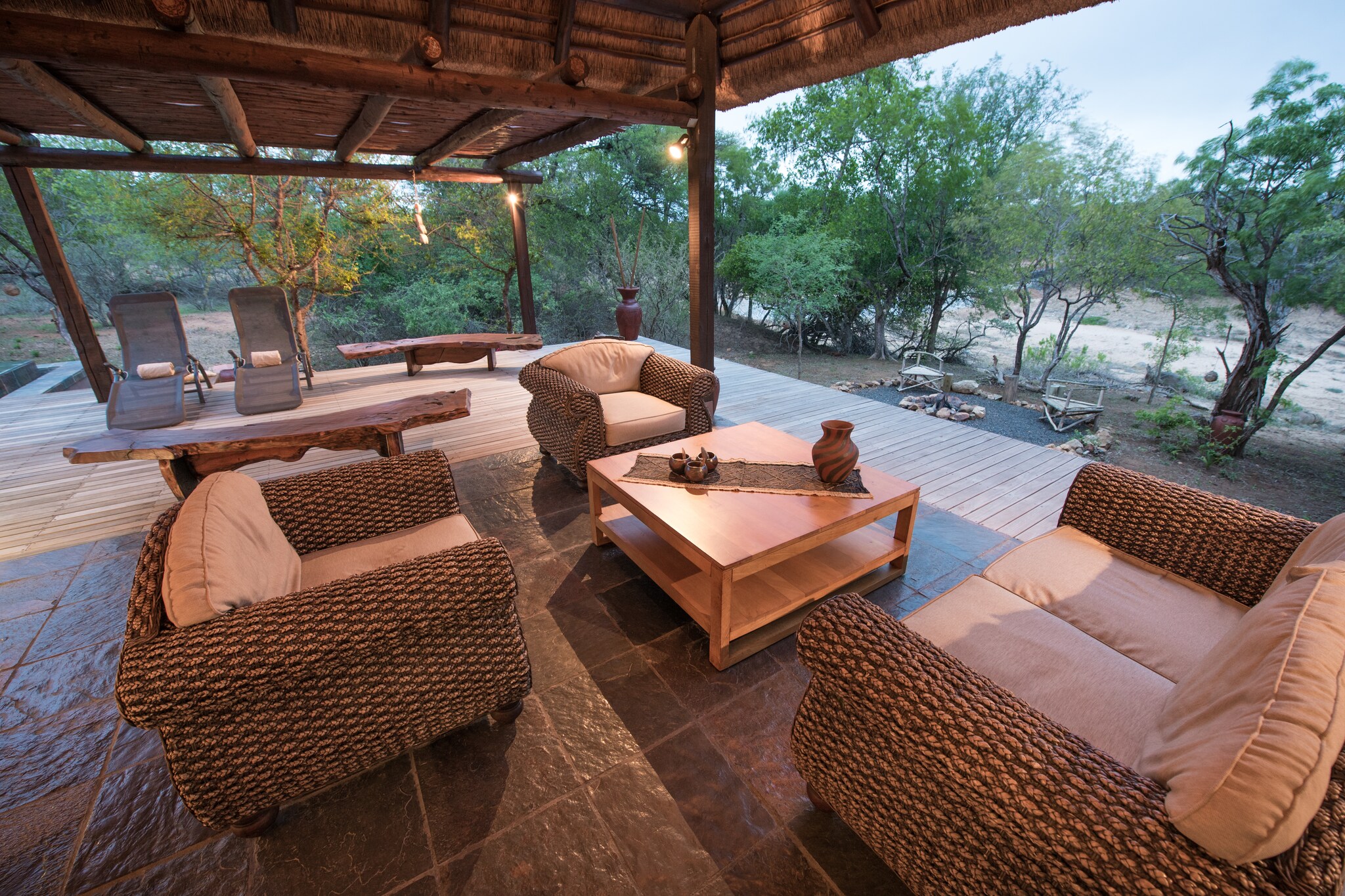 Ground floor: (open kitchen(oven, microwave, dishwasher, dishwasher, fridge, freezer), Living/diningroom(TV, dining table, seating area), Bedroom with bathroom(double bed, bath tub, shower, washbasin, washbasin, toilet), Bedroom with bathroom(double bed, bath tub, shower, washbasin, washbasin, toilet), Bedroom with bathroom(double bed, shower, washbasin, washbasin, toilet), toilet(washbasin, toilet))\n\ndining table, tumble dryer, washing machine, air conditioning, terrace, garden, garden furniture, BBQ, parking, swimming pool(private, heated), lounge set, outdoor fireplace