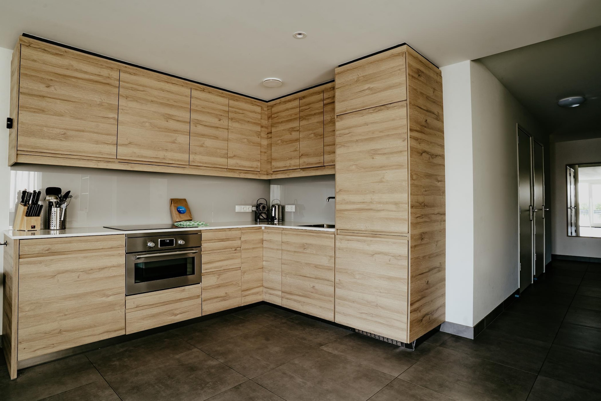 Ground floor: (hallway(toilet), Living room(TV), open kitchen(electric kettle, coffee machine(cups), combination microwave, dishwasher, fridge-freezer), bedroom(double bed(180 x 200 cm)), bedroom(single bed(90 x 200 cm), single bed(90 x 200 cm)), bedroom(single bed(90 x 200 cm), single bed(90 x 200 cm)), bathroom(shower, washbasin, toilet), storage(tumble dryer, washing machine))\n\njetty, heating(central), terrace, garden furniture, parking, Charging post for electric cars