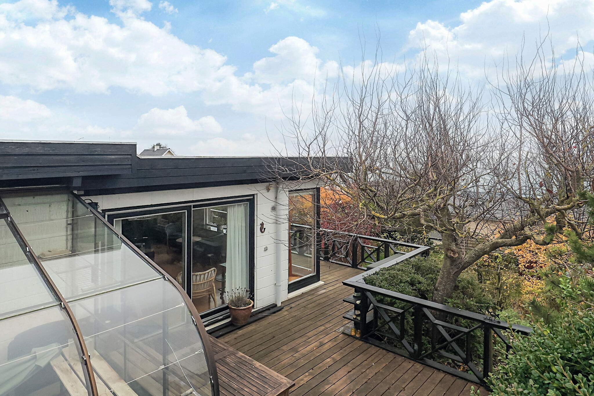 Highly located authentic cottage in the second row with magnificent views of the water and the Great Belt Bridge.The holiday home was built in 1975 and last renovated in 1995, and the interior is also older but in good working order.The living room, bedrooms, kitchen, and bathroom have sea views.A charming, atypical, high-altitude cottage, partially built into the ground.For those who are less interested in decor and interior design and more interested in location, views, nature, and peaceful surroundings.Upstairs there is a bathroom with shower, living room with access to a large terrace, kitchen-dining room and a large renovated bedroom/living room with double bed and wood-burning stove.Downstairs, there is a large bedroom with a double bed and a single bed, and direct access to a partially covered terrace and the garden.The annex, which is best suited for summer use, is furnished with a double bed. There is a satellite dish with German and Danish channels, as well as fast Wi-Fi and Chromecast for streaming your own TV packages.The garden, pergola, and wooden terrace are well planted, cozy, and largely secluded.Located just over 100 meters from a child-friendly sandy beach and the coast, which offers good fishing all year round.Water and gas (for cooking) are included in the price.Not available for rent to youth or tradespeople groups.A refundable deposit might be charged closer to your check-in date. The security deposit ensures a smooth stay and covers any additional services or consumption charges.This deposit covers utilities consumed during your stay and any additional services that may be taken.The final amount will be adjusted based on actual meter readings, actual usage of extra services, and any remaining balance will be refunded within 21 days after checkout.This deposit simply acts as a prepayment for charges that  you would anyways pay for, ensuring a seamless stay and check-out experience.