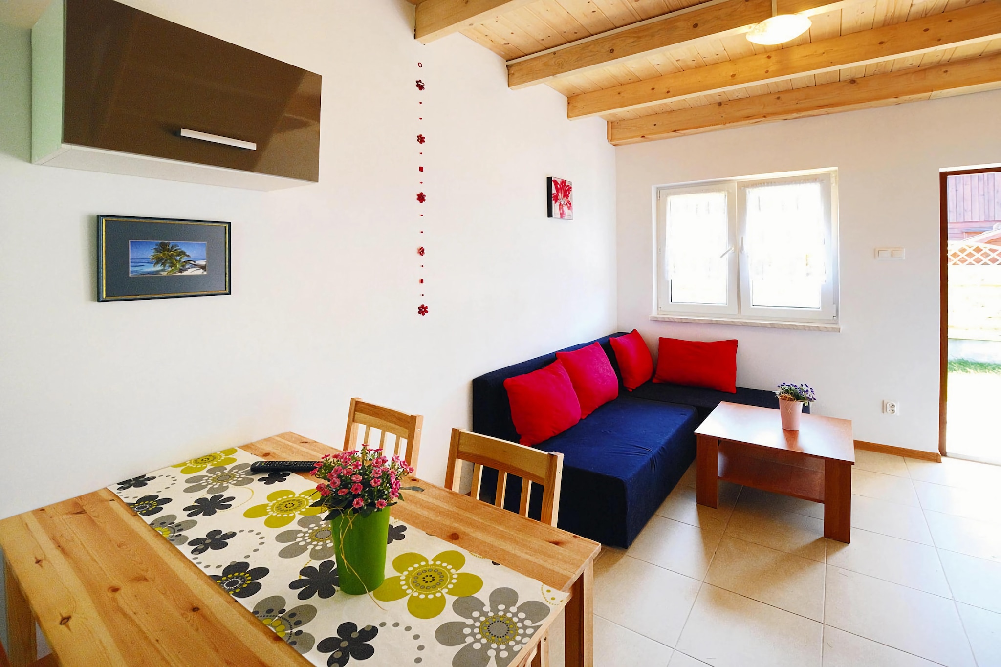 In a quiet area, on a side street, there is a family holiday resort, which, in addition to accommodation in comfortable terraced houses, also offers a large fenced recreational area. The seaside beach is only 250 m away. The center of charming Sarbinowo with numerous restaurants, cafes and shops is just a few steps away.
Comfortable, two-story terraced houses adapted to accommodate a maximum of 4 people (+ possibly 1 person on an extra bed). On the ground floor there is a spacious living room connected to the kitchen. In the living room there is a fold-out, 2-person sofa, table and TV. On the ground floor there is also a bathroom with a shower. On the first floor there are 2 separate bedrooms (including 1 walk-through). Each house has a covered terrace with a set of garden furniture and deckchairs. Barbecue equipment available. Electric heating. Wireless internet is available.
On the well-kept fenced property there is an attractive playground for children with a trampoline. There is a parking lot.
The price of your stay includes: bed linen, water consumption, final cleaning, internet, parking (1 month).
Sarbinowo is a small, picturesquely situated summer resort on the west coast, a few kilometres west of Mielno. Clean, wide beaches await you here, ideal for escaping the hustle and bustle of the city. It is a great place for a trip with family or friends.
For families with children, the Pomerania Fun Park is a great destination for a full-day trip. On an area of ​​over 30 ha, the whole family can spend time having fun together. In addition, there are two restaurants and numerous catering points at the guests' disposal.
The international R-10 cycling trail running around the Baltic Sea basin runs a short distance from the resort. We recommend trips to the picturesque Chłopy, the centre of Sarbinowo, the lighthouse in Gąski, Ustronie Morskie.