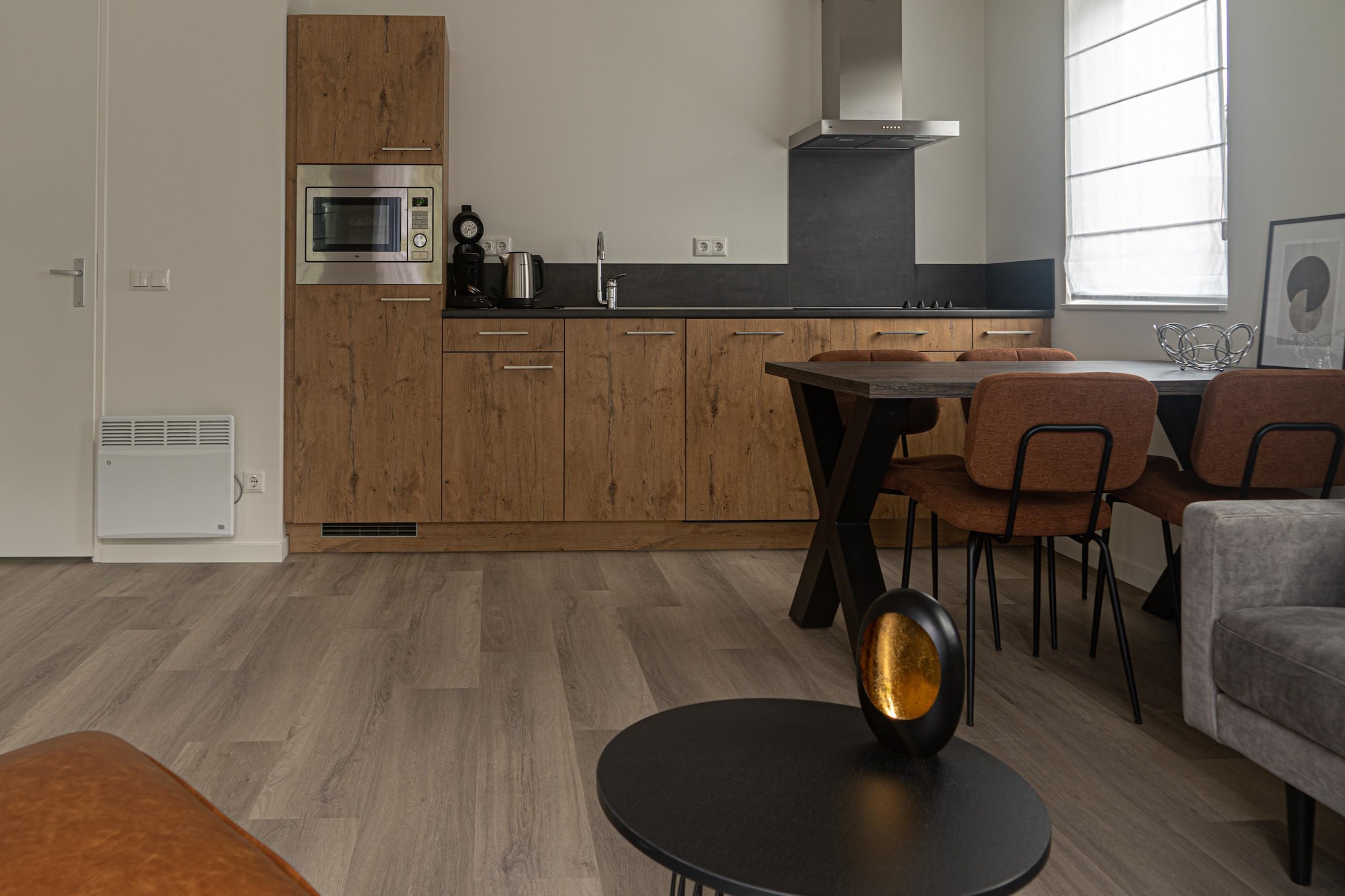 Ground floor: (hallway, Living room(TV, seating area), open kitchen(electric kettle, coffee machine, combination microwave, dishwasher, fridge(+ freezer), electric hot plates), bedroom(single bed, single bed), bedroom(single bed, single bed), bathroom(shower, washbasin, toilet), bathroom(shower, washbasin), toilet(washbasin, toilet))\n\ntumble dryer, washing machine, garden doors, terrace(roofed), terrace, garden furniture