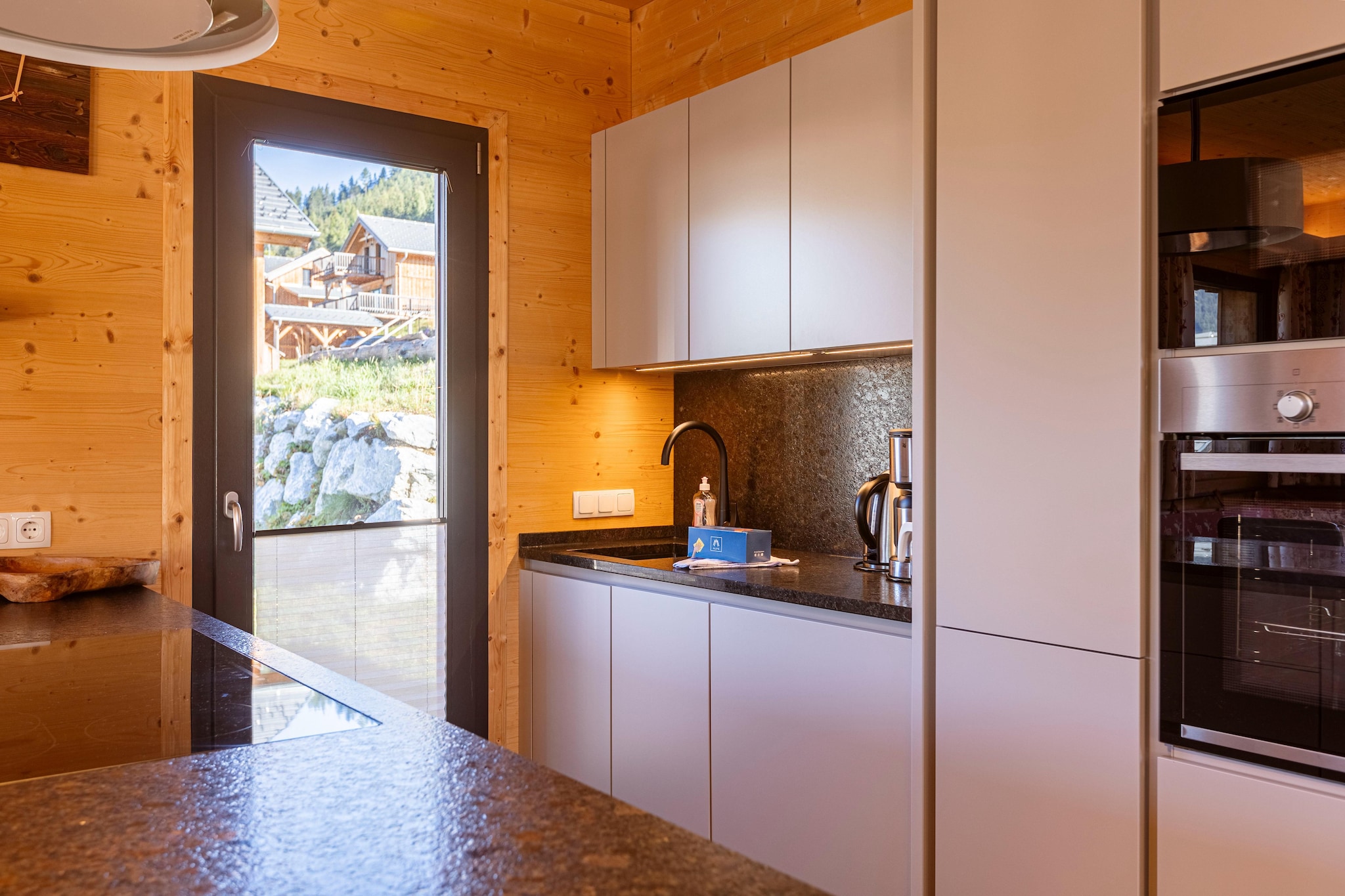 Ground floor: (Entrance, Living room(TV(cable), dining table, seating area), open kitchen(hob(4 ring stoves, ceramic), electric kettle, toaster, coffee machine(filter), oven, microwave, dishwasher, fridge-freezer), bathroom(shower, infrared sauna, toilet), Internet access, balcony or terrace)\n\nOn the 1st floor: (bedroom(double bed), bedroom(double bed), bedroom(double bed), bedroom(double bed), bathroom(shower, toilet, hairdryer))\n\nTV(cable), garden furniture