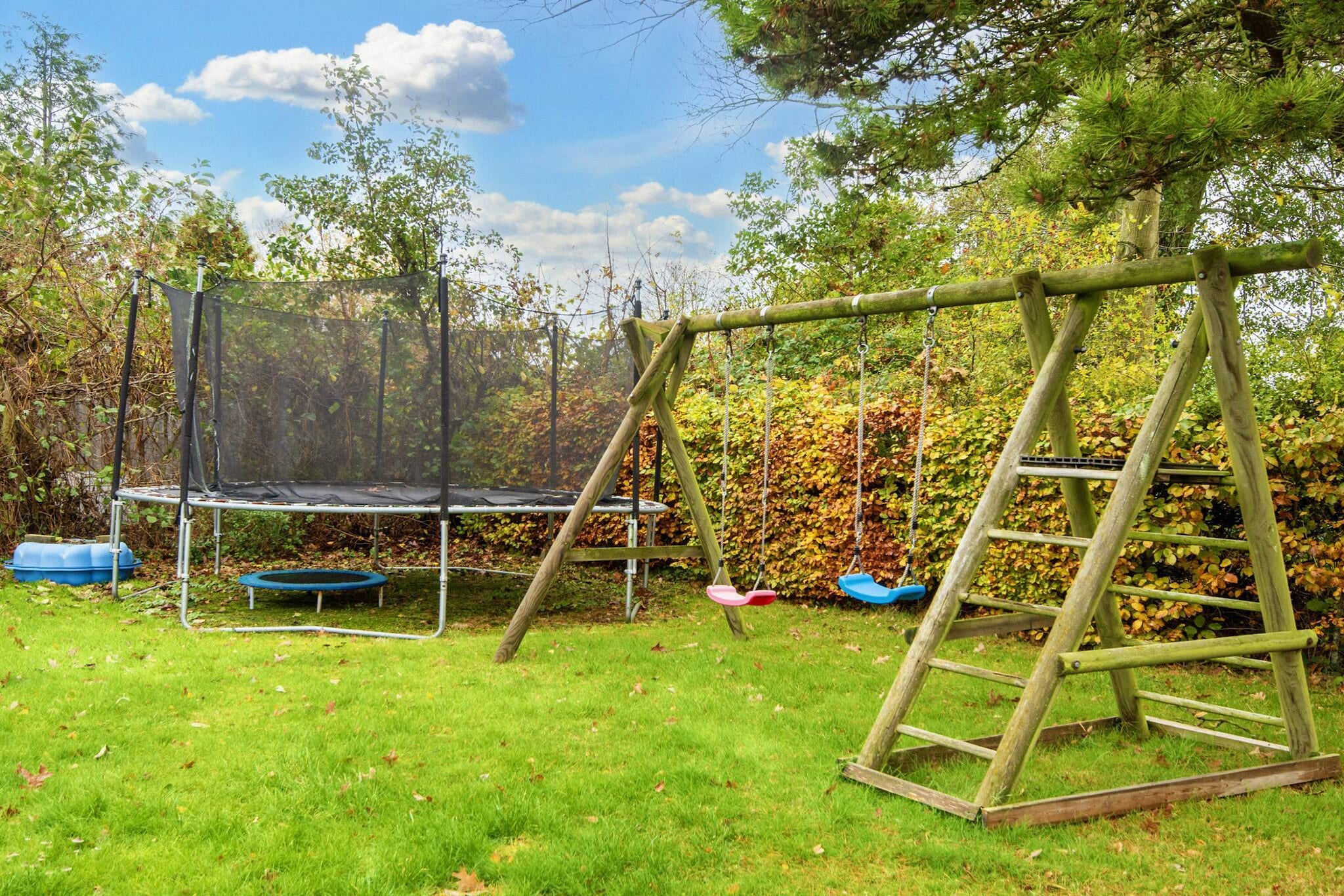 This charming holiday home near Skovmose offers a comfortable and inviting retreat just a short walk from the beach. Built in 1985 and carefully maintained over the years, it combines classic character with modern comforts, making it ideal for families, multi-generational groups, or friends seeking a relaxed coastal getaway. Inside, the spacious living kitchen with a wood-burning stove serves as a warm and welcoming hub for cooking, dining, and spending time together. A separate TV room provides additional space for relaxation and leads directly to the terrace, which is equipped with garden furniture and a barbecue, perfect for outdoor meals or simply enjoying the fresh air. The house features two bedrooms with double beds, while a third double bed is located in a separate annex nearby. The annex also includes a TV and a separate WC, offering privacy and flexibility — ideal for teenagers, grandparents, or extra guests. Outside, multiple terraces provide options for dining, grilling, or simply lounging in the sun. One terrace is covered, allowing guests to enjoy the outdoors in comfort regardless of the weather. Surrounded by a peaceful garden, the property creates a private and tranquil setting while still being close to the sandy beach. With its thoughtful layout, welcoming atmosphere, and prime location near the coast, this holiday home offers a memorable and relaxing stay. Please note: rental to youth groups is not permitted.