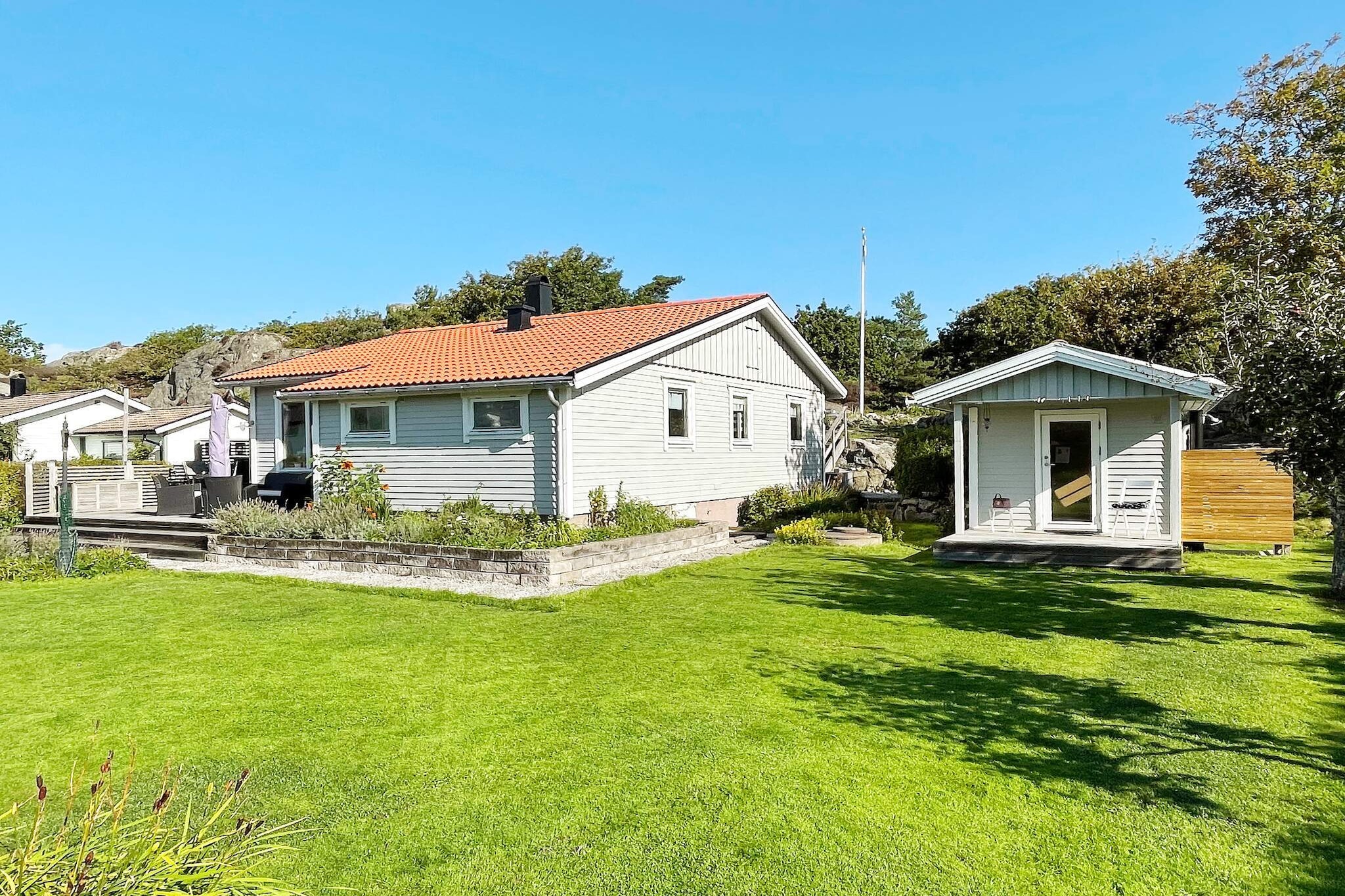 Spacious cottage with a good standard and close to the sea in charming Kyrkesund on western TjÃ¶rn. Perfect for larger families or groups who both want comfortable accommodation within walking distance to salty dips and many attractions within easy driving distance. The whole family will have a great time here! Here you live in a quiet and child-friendly cottage area with walking distance to salty baths. The house is located on a lovely plot with both a lawn for play and games as well as a hilly natural plot with several patios on ledges. You have a nice view from the mountain that borders the plot behind the house. The front of the house has a lovely terrace with outdoor furniture and a lounge group where you can prepare a good meal with drinks. Choose whether you want to follow the sun's path in the sky or sit in the shade or under a parasol. Here it is easy to enjoy your holiday. The house is on one level and contains a modern kitchen with a dining area and an exit to the back, a living room with a TV corner (Chromecast, not channels) and a warming wood stove. Four bedrooms, one of which is a double room with access to the balcony, one with a single bed and desk, one with a bunk bed and the fourth with a modern pull-out double bed (so-called day bed). Bathroom with shower, WC and washing machine. Only approx. 700 m to the bathing area with jetty and rocks. In the immediate area there are many different hiking trails. Feel free to visit the nearby Sculpture in Pilane, which is one of Sweden's most beautiful cultural landscapes with traces from the Stone Age. Here the sheep graze freely alongside fun, exciting, thought-provoking art by some of the world's leading artists. Feel free to take the ferry across the strait to HÃ¤rÃ¶n and the well-visited restaurant Magasinet. BjÃ¶rholmen's Marina also has a good restaurant when you want to avoid cooking yourself. Many attractions and charming archipelago communities in the immediate area. Feel free to visit the central town of SkÃ¤rhamn, 14 km with a rich entertainment and cultural offer where the Nordic Watercolor Museum is the most famous. Also take the opportunity to experience the archipelago and the small fishing villages around TjÃ¶rn such as KlÃ¤desholmen or take the ferry from RÃ¶nnÃ¤ng to the nearby car-free islands of Ã…stol, DyrÃ¶n and TjÃ¶rnekalv. The big city Gothenburg with the well-known amusement park Liseberg approx. 70 km. The house has fiber. Welcome!