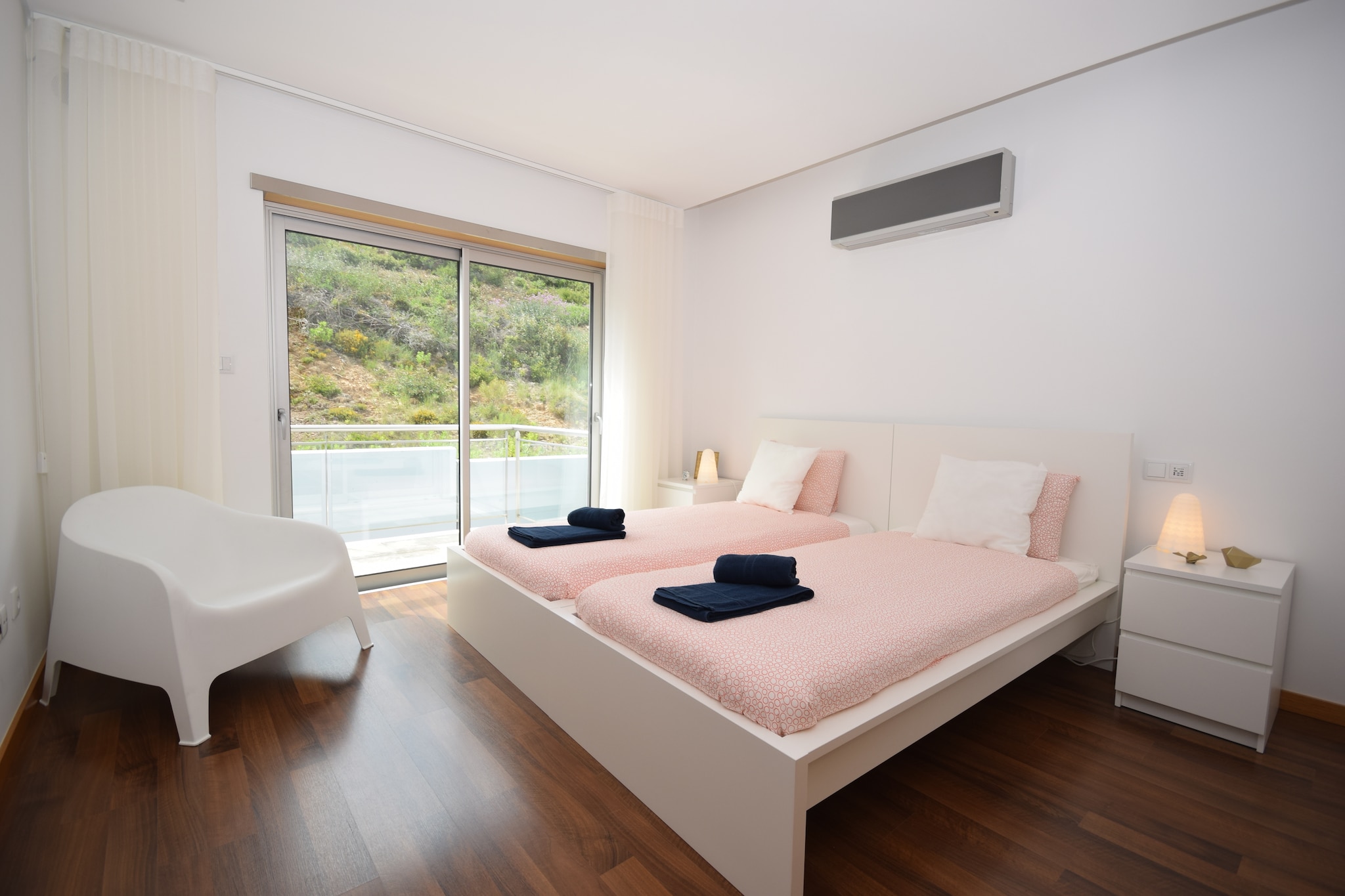 Ground floor: (storage(tumble dryer, washing machine), garage)\n\nOn the 1st floor: (Living room(TV(cable), dining table, seating area, balcony), Kitchen(electric kettle, toaster, cooker(ceramic), coffee machine, oven, microwave, dishwasher, fridge-freezer), Bedroom with bathroom(double bed(160 x 200 cm), shower, washbasin, toilet), terrace)\n\nOn the 2nd floor: (Bedroom with bathroom(double bed(160 x 200 cm), bathtub with shower, washbasin, toilet, balcony), Bedroom with bathroom(2x single bed(90 x 200 cm), shower, washbasin, toilet))\n\nrecreation room, heating, air conditioning, air conditioning, terrace, garden furniture, sun loungers, BBQ, parking, deckchairs, parasol, swimming pool(shared with other guests, heated), bicycles available, children\'s bed, high chair, high chair, ironing board, party games