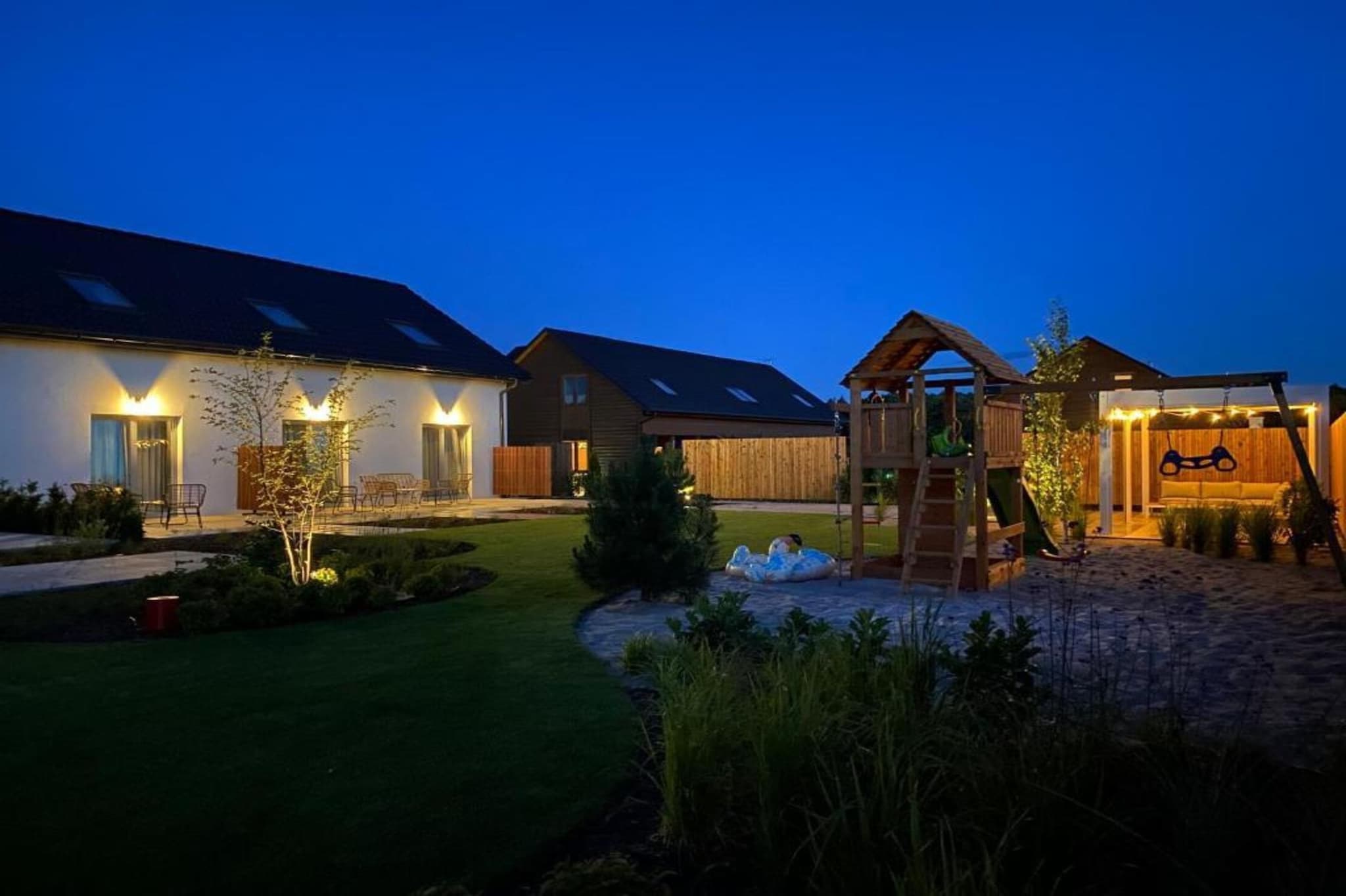 A cozy resort on the outskirts of a quiet summer resort (Grzybowo). The quiet area is perfect for relaxation. Close to the resort center, where there are numerous bars, restaurants and shops. Kołobrzeg invites you for larger purchases or in search of more attractions.
A 2-storey holiday home on a fenced, safe property. On the ground floor there is a large, open space with a well-equipped kitchen and living room. On the ground floor there is also a bathroom with a shower (there is a washing machine here). On the first floor there are 2 separate bedrooms. Central heating. The house has a terrace with a set of lounge furniture and barbecue equipment. Wireless internet is available.
On the premises there is a playground, a garden gazebo and parking (in the price of the stay 1 place/house).
In the price of the stay: bed linen, towels, electricity and water consumption, heating, final cleaning, internet, parking (1 place/house), highchairs (requires prior notification).
The location allows quick access to a wonderful, wide beach. The longest bike path in Poland (R-10) runs nearby, which is an easy and pleasant way to visit the neighboring resorts by bike: Kolobrzeg, Dzwirzyno, Sianozety, Ustronie Morskie.
Grzybowo is a seaside town often chosen by tourists due to its intimate character. For those in need of more attractions, you can go to neighboring Kołobrzeg, where you can visit the seaport, walk to the pier or along the seaside promenade. Kołobrzeg is a city bustling with life. You can get there by regular public transport, by bike or by car.
Dźwirzyno, neighboring Grzybowo from the west, is also a seaside town. It is characterized by a calmer atmosphere. It is worth visiting this settlement because of Lake Resko, where you can spend your time actively renting various types of water equipment.